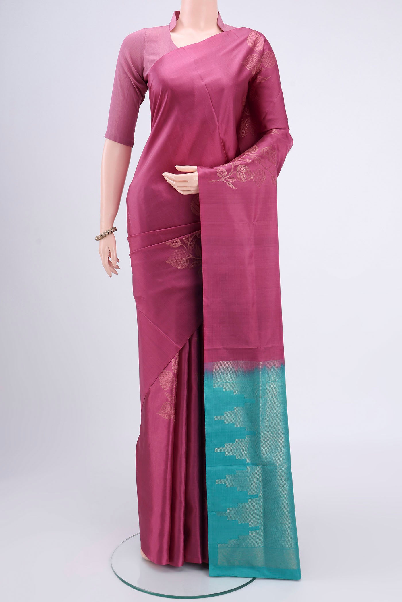 Dark Mauve Dual Tone Soft Silk Saree with Zari Butta on the body and Plain Border.  displayed on a mannequin