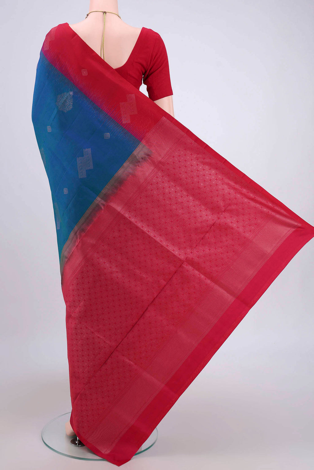 Flat view of Turquoise Soft Silk Saree with Zari Butta on the body and Zari Border. 