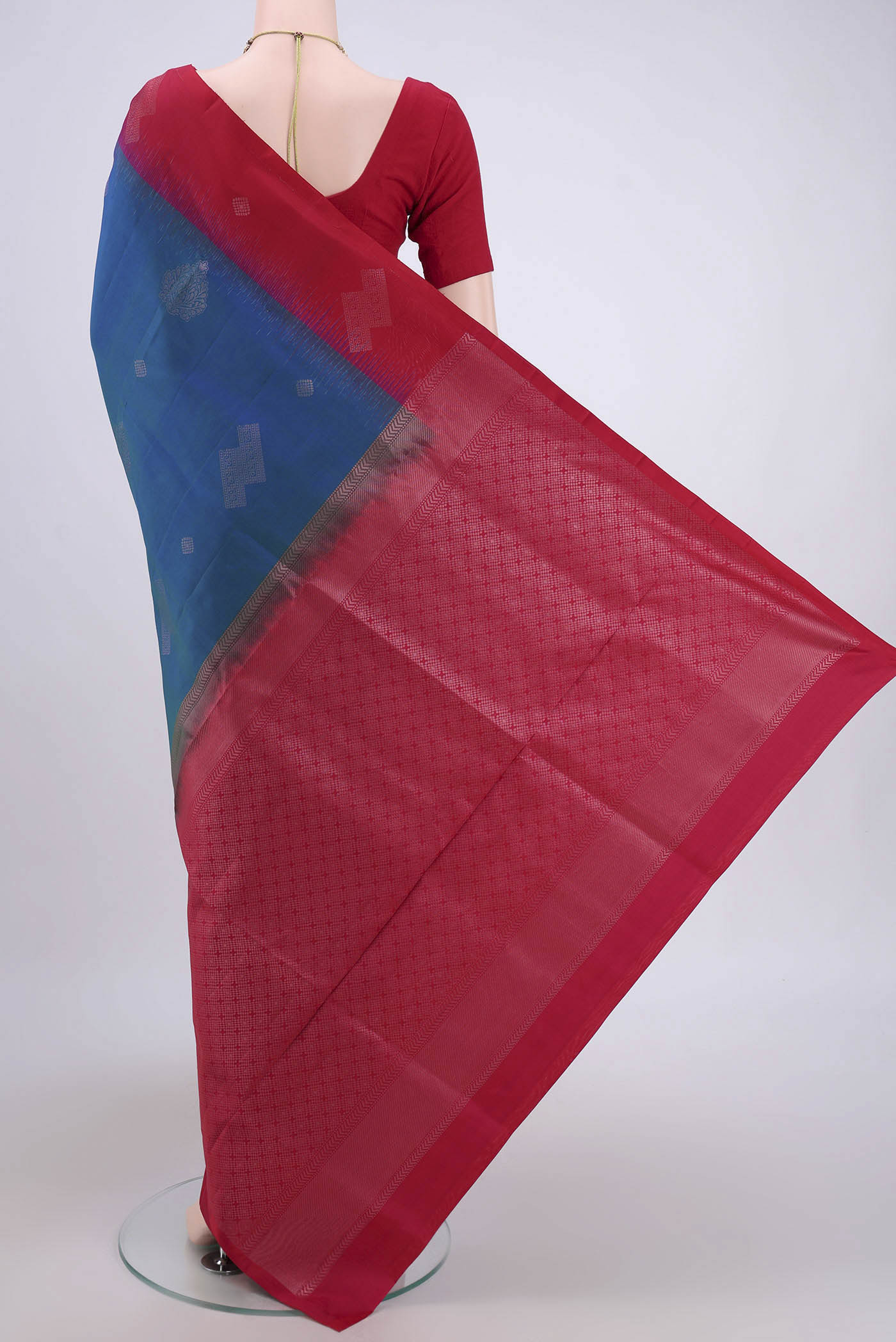 Flat view of Turquoise Soft Silk Saree with Zari Butta on the body and Zari Border. 