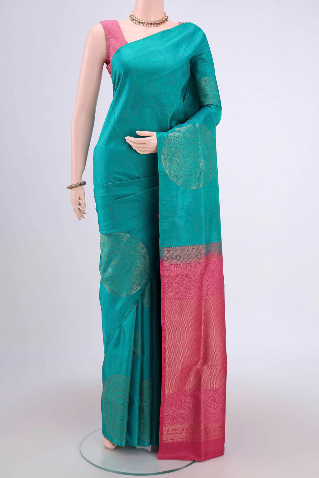 Blue Soft Silk Saree with Zari Butta on the body and Zari Border.  displayed on a mannequin
