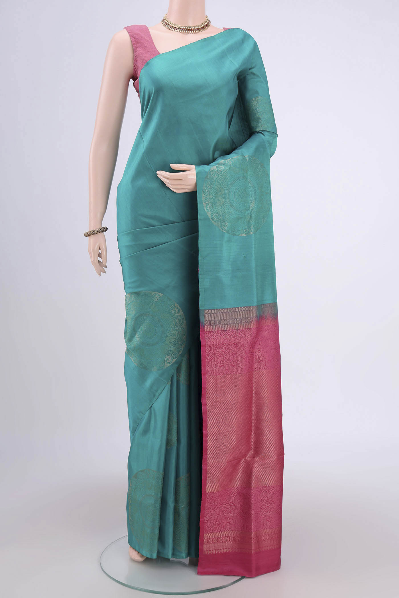 Blue Soft Silk Saree with Zari Butta on the body and Zari Border.  displayed on a mannequin