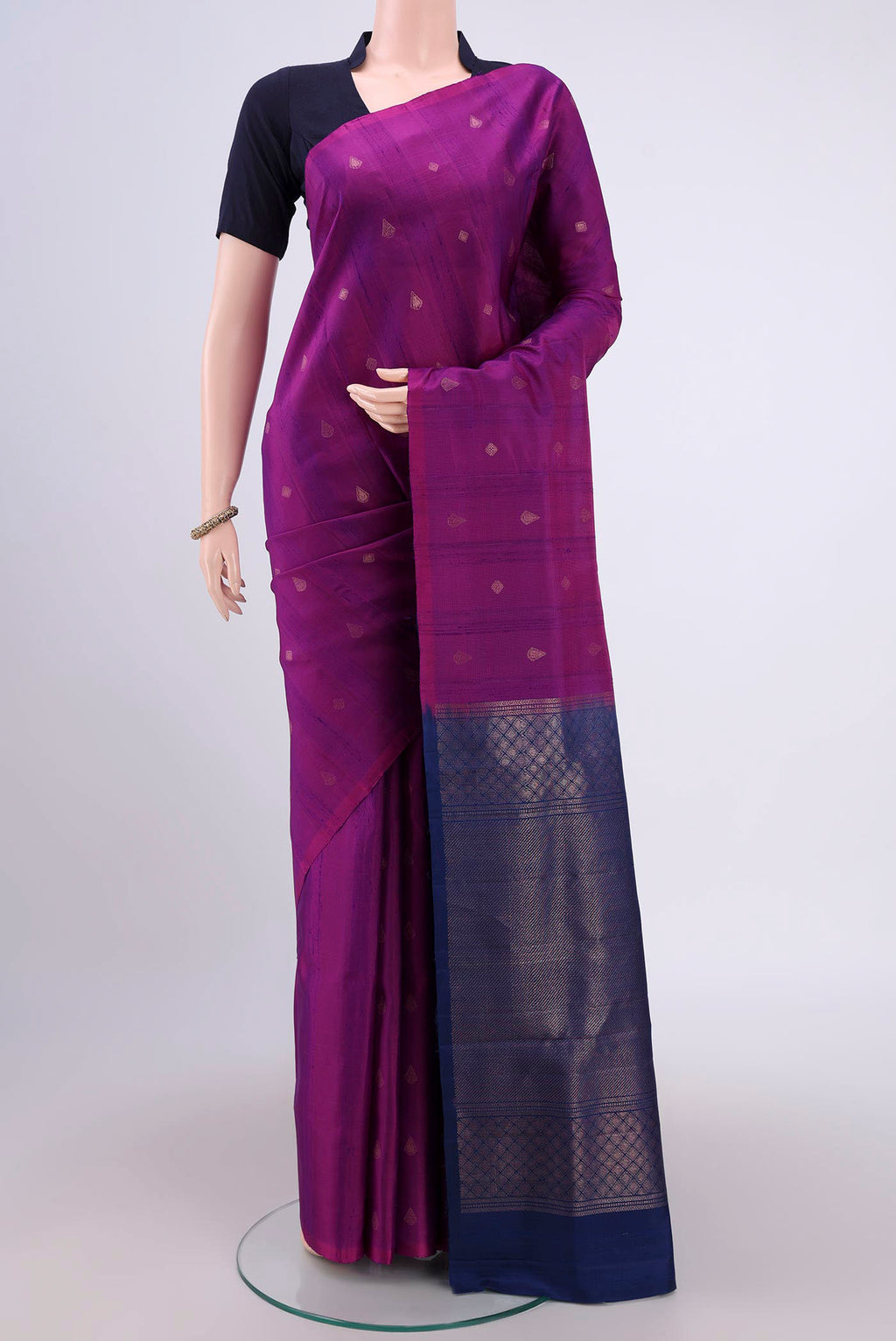 Magenta Soft Silk Saree with Zari Butta on the body and Zari Border.  displayed on a mannequin