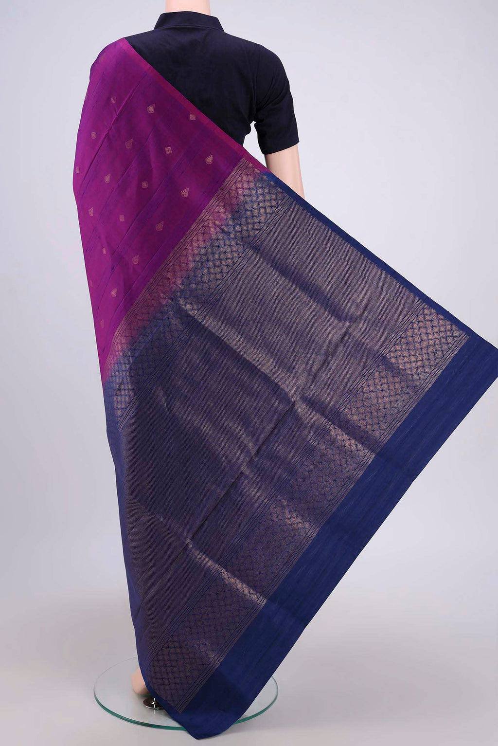 Flat view of Magenta Soft Silk Saree with Zari Butta on the body and Zari Border. 