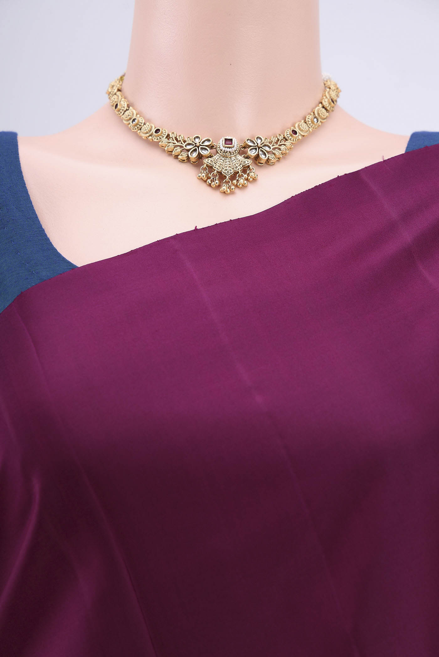 Border image of Burgundy Soft Silk Saree with Zari Butta on the body and Zari Border. 