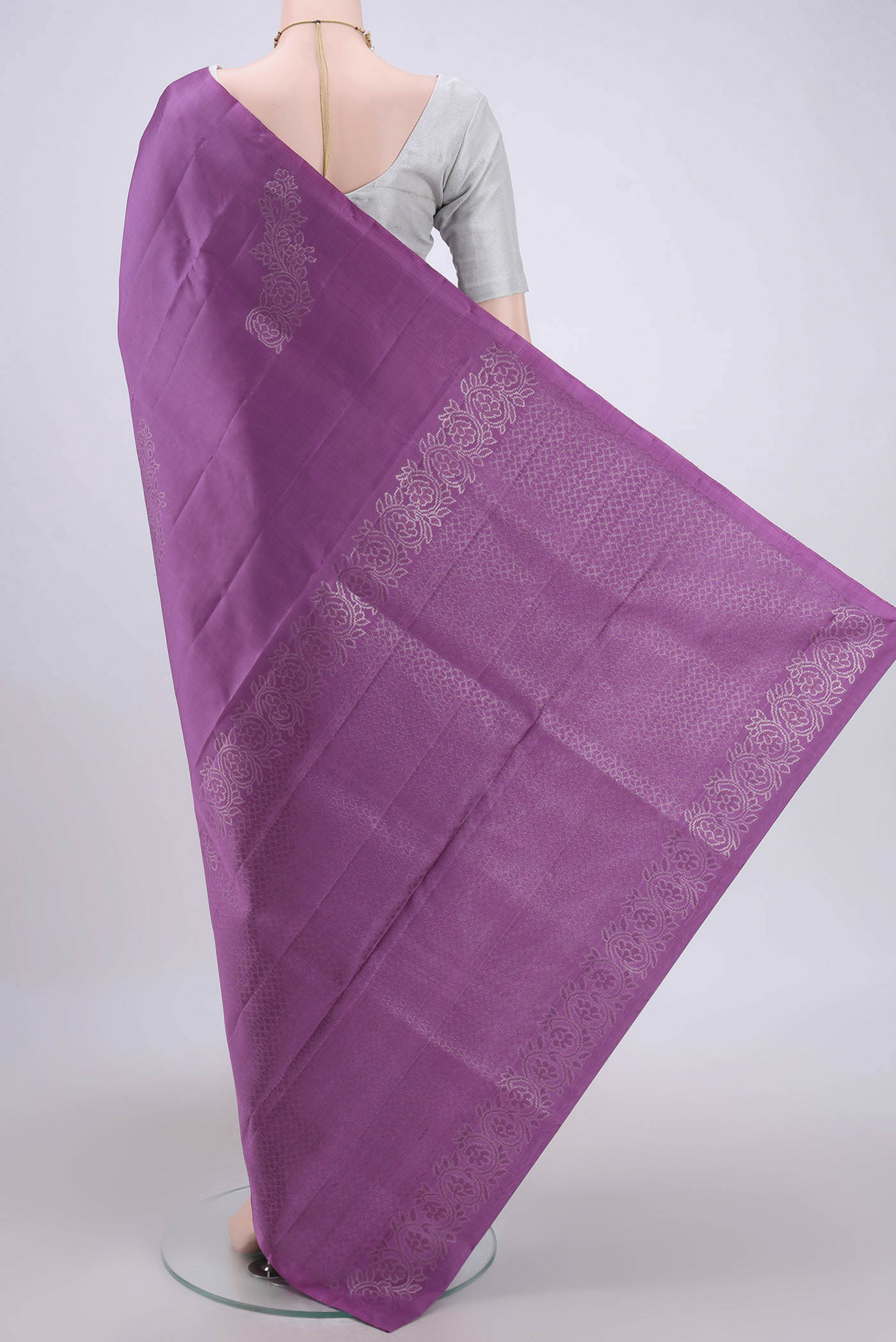 Flat view of Mauve Soft Silk Saree with Zari Butta on the body and Zari Border. 