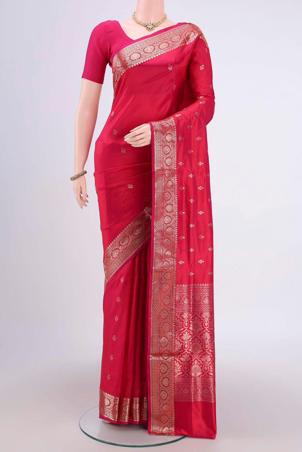 Dark Pink Banarasi Katan Silk Saree with Zari Butta on the body and Zari Border.  displayed on a mannequin