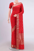 Imperial Red Banarasi Katan Silk Saree with Zari Butta on the body and Zari Border.  displayed on a mannequin