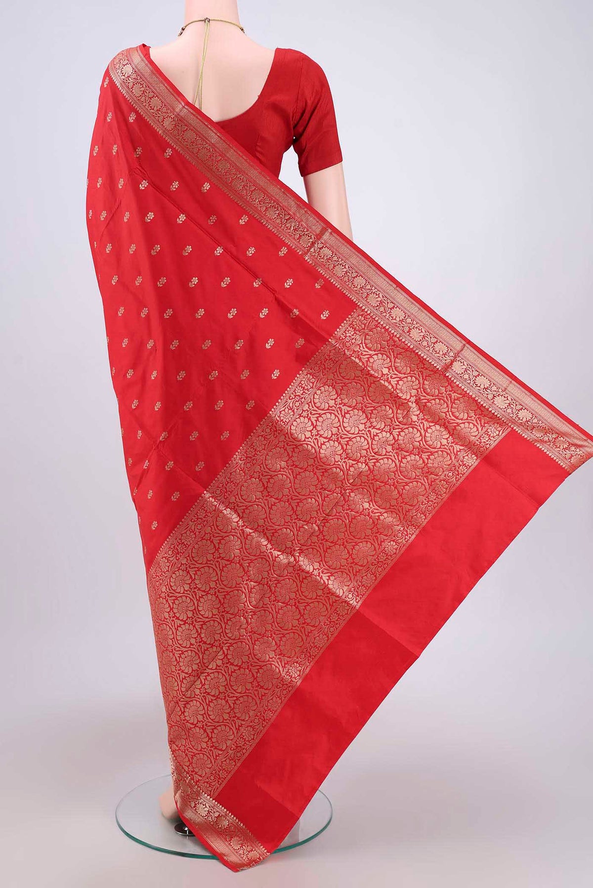 Flat view of Imperial Red Banarasi Katan Silk Saree with Zari Butta on the body and Zari Border. 