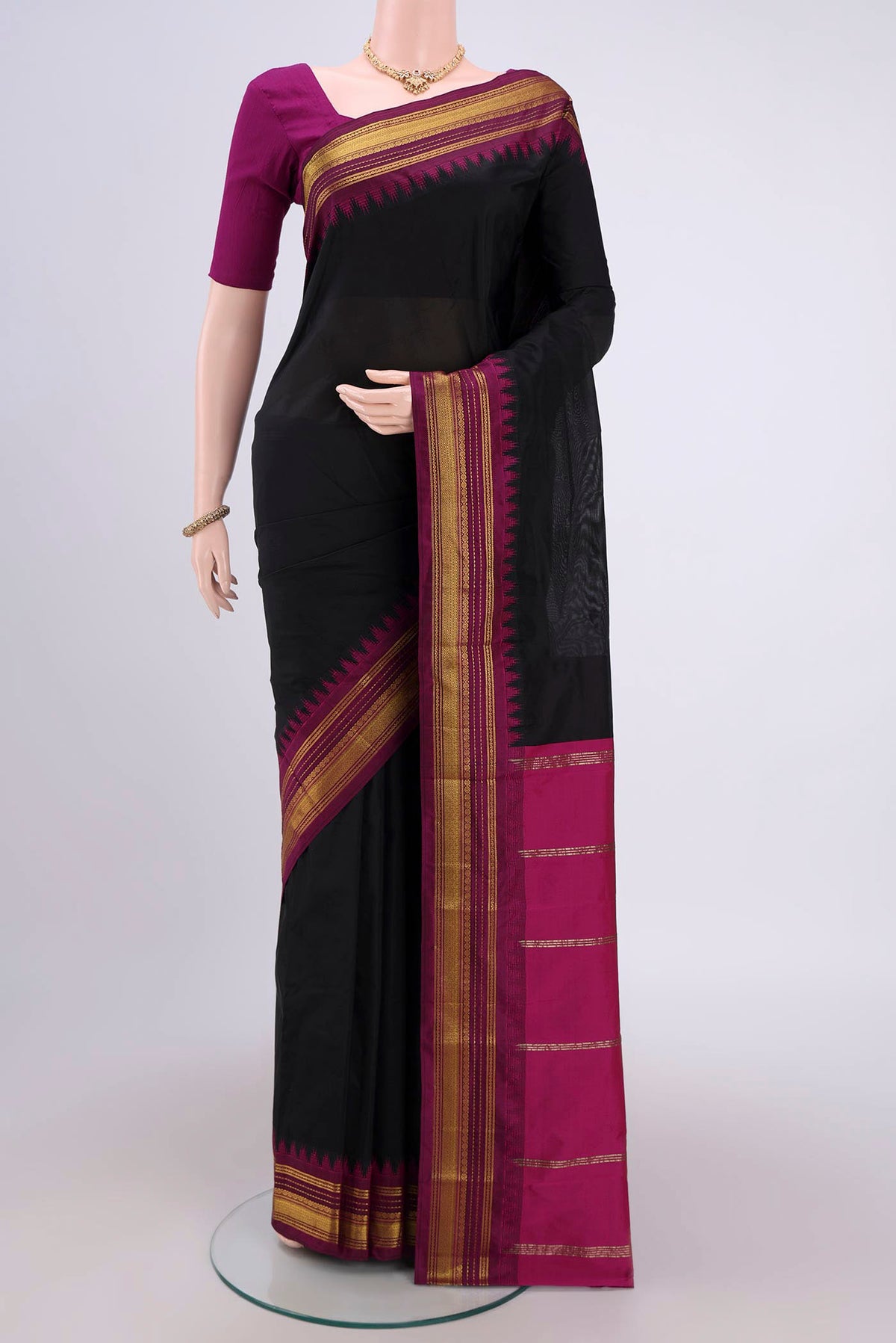 Black Bangalore Silk Saree with Plain Body and Zari Border.  displayed on a mannequin