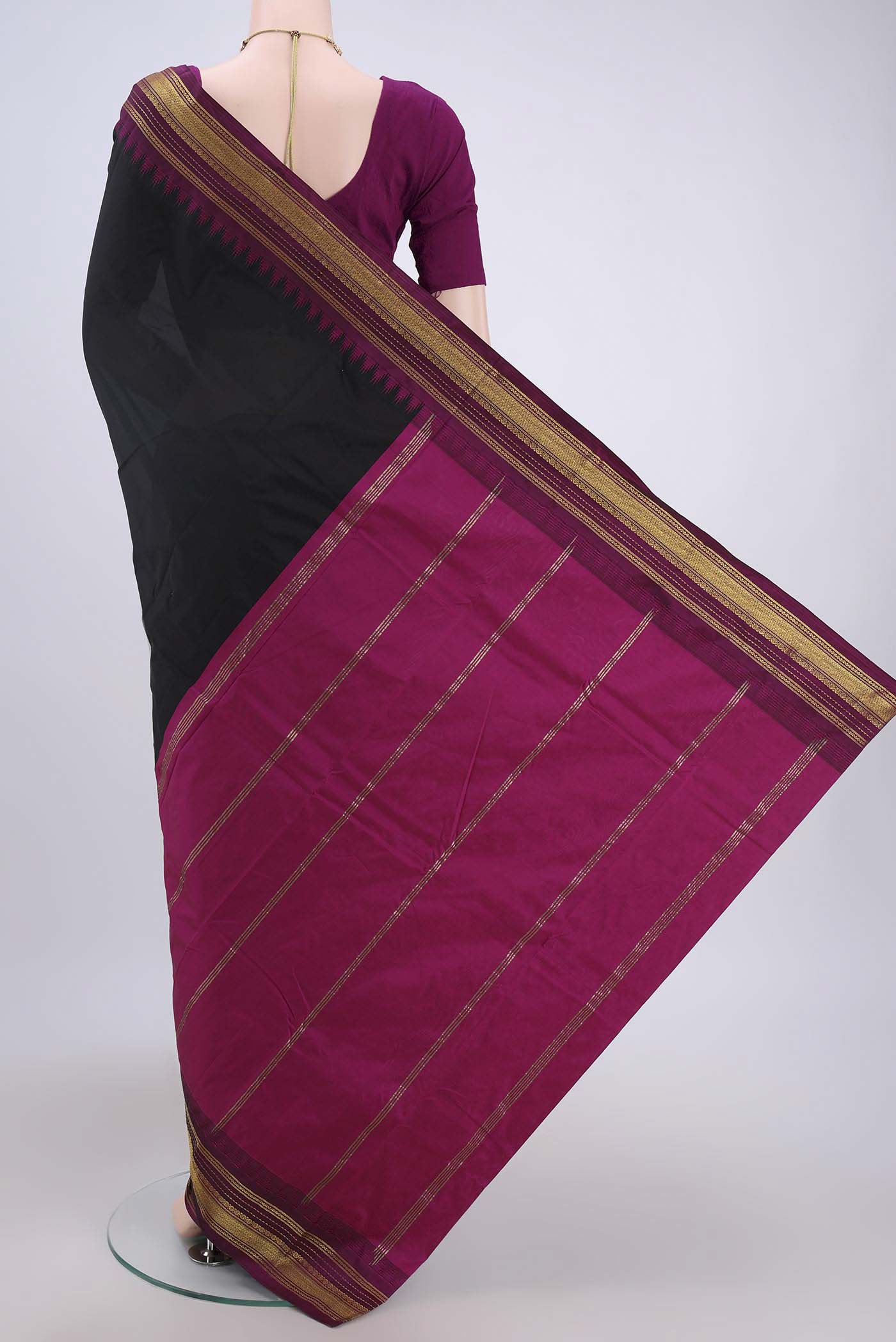 Flat view of Black Bangalore Silk Saree with Plain Body and Zari Border. 