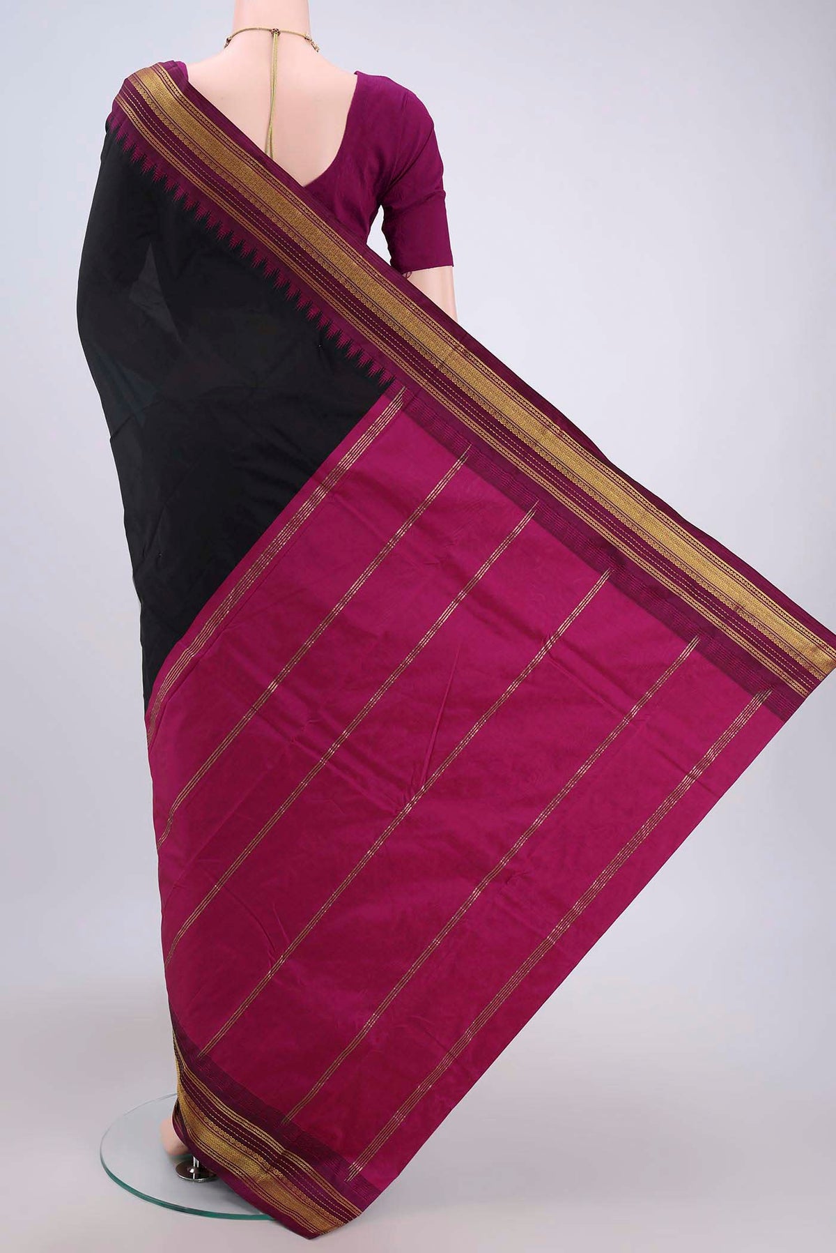Flat view of Black Bangalore Silk Saree with Plain Body and Zari Border. 