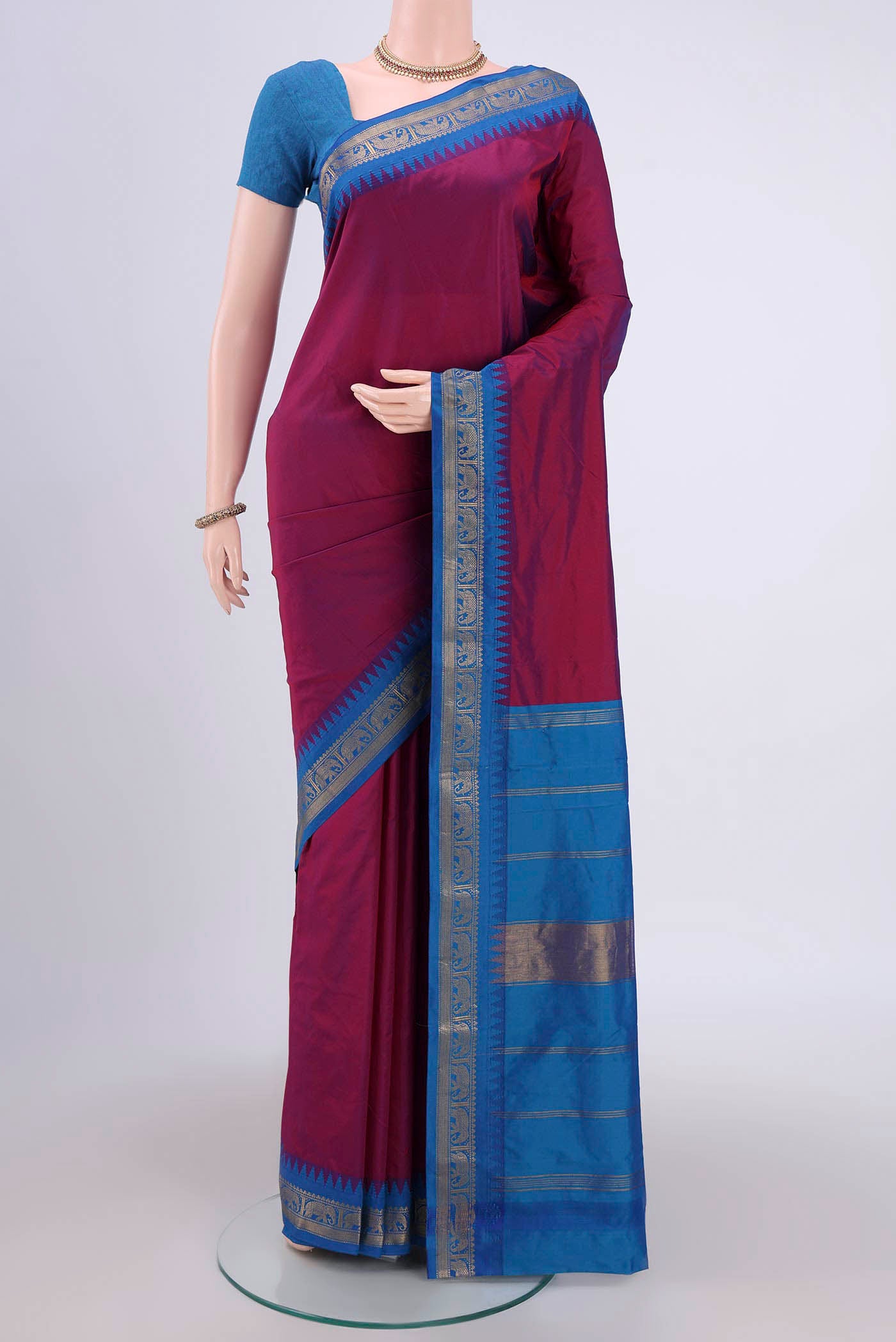 Magenta Bangalore Silk Saree with Plain Body and Zari Border.  displayed on a mannequin