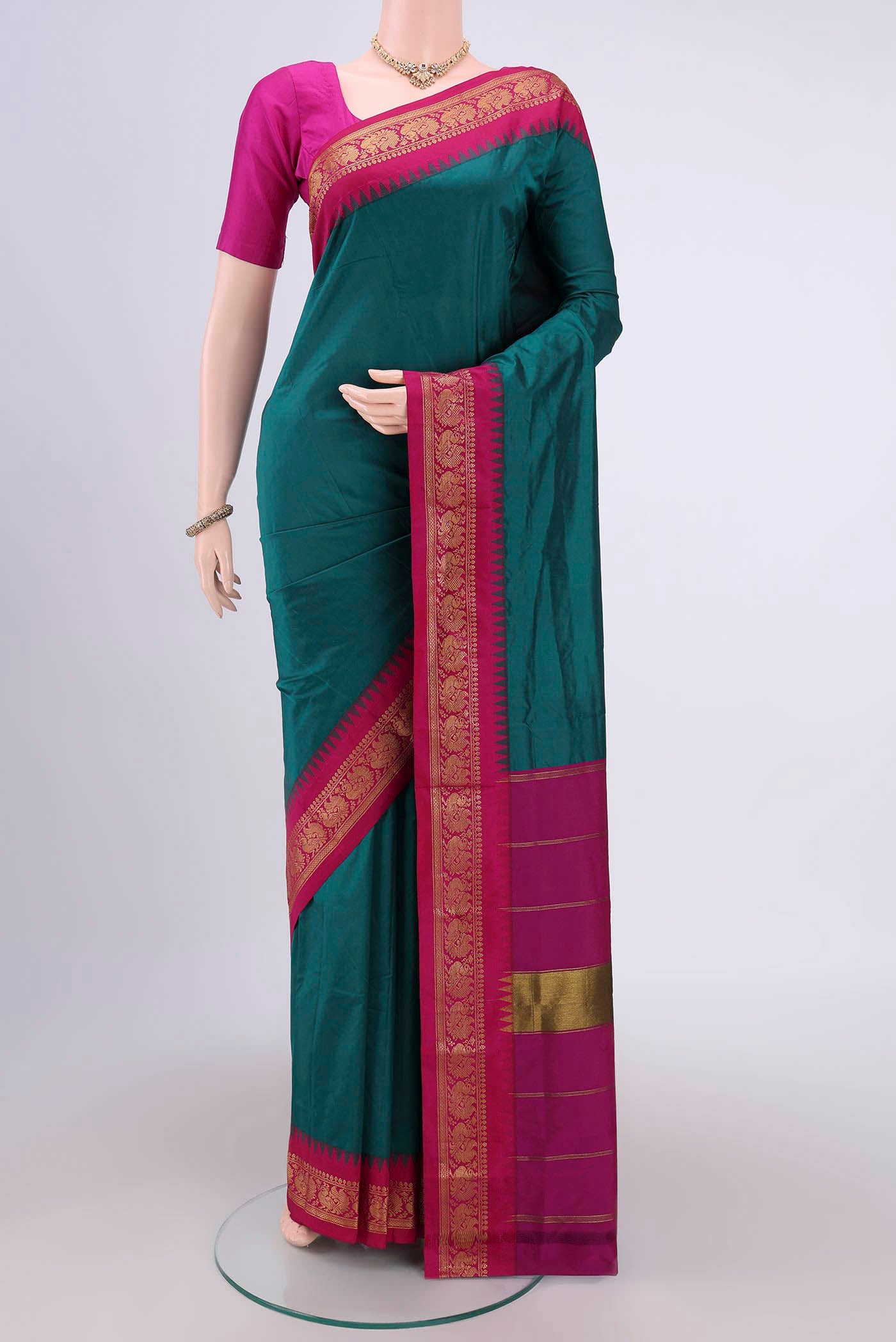 Sea Green Bangalore Silk Saree with Plain Body and Zari Border.  displayed on a mannequin
