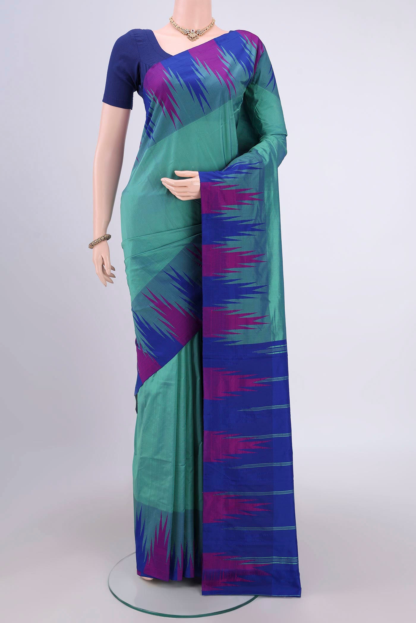 Sea Green Bangalore Silk Saree with Plain Body and Temple Border.  displayed on a mannequin