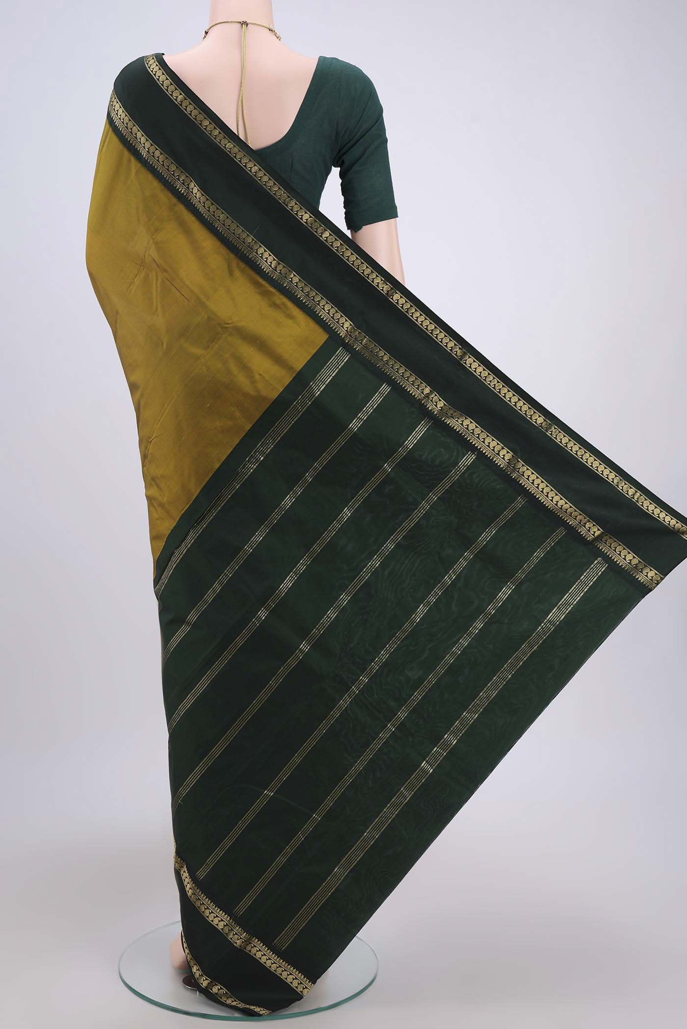 Flat view of Mehandi Green Bangalore Silk Saree with Plain Body and Zari Border. 
