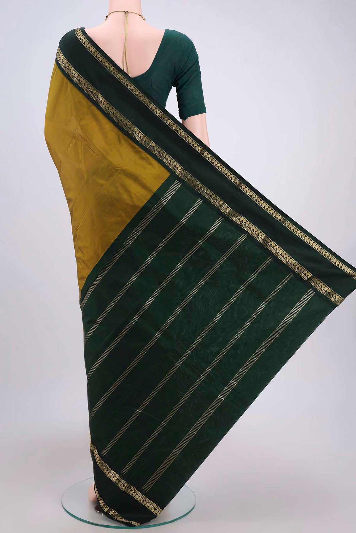 Flat view of Mehandi Green Bangalore Silk Saree with Plain Body and Zari Border. 