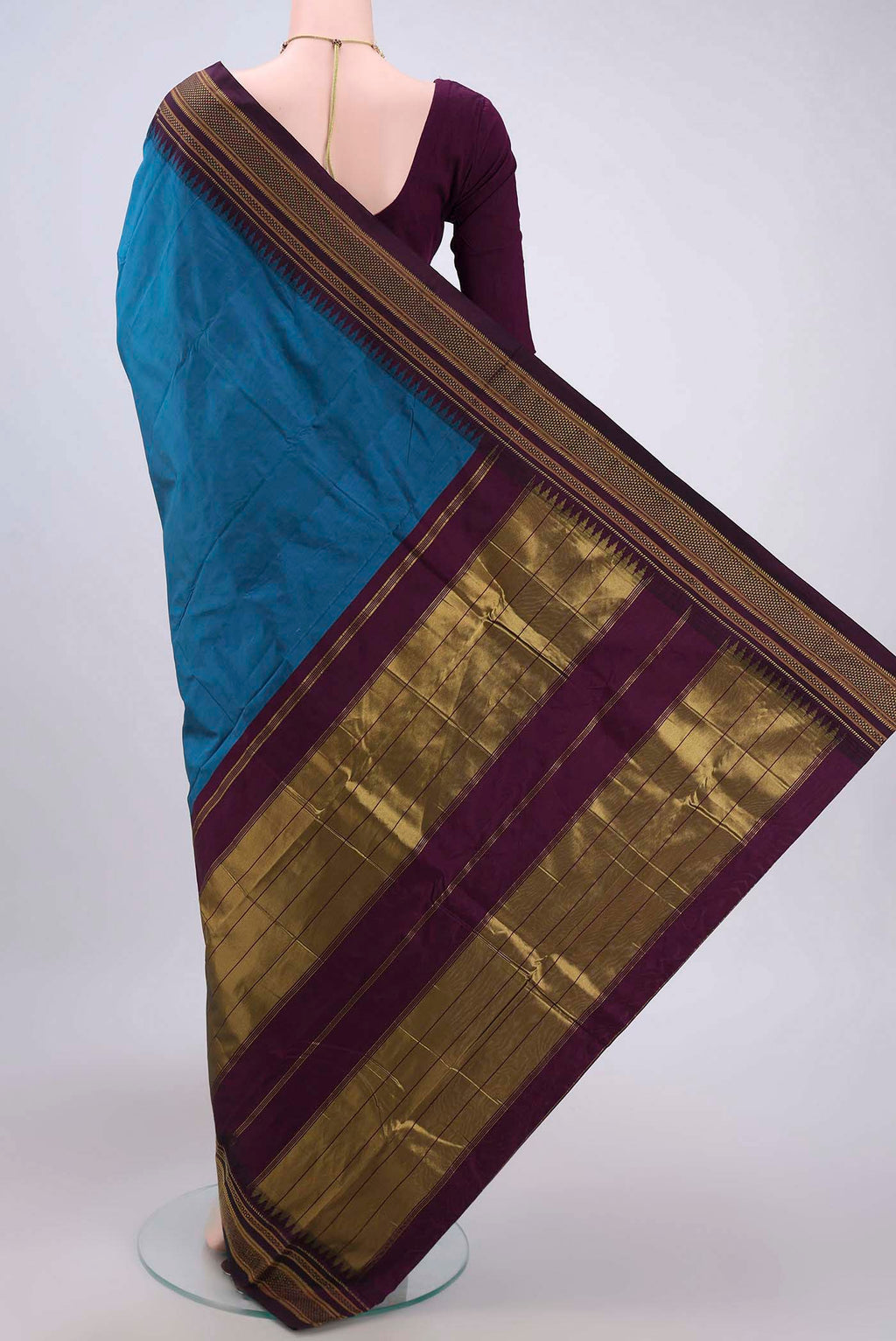 Flat view of Blue Bangalore Silk Saree with Plain Body and Zari Border. 