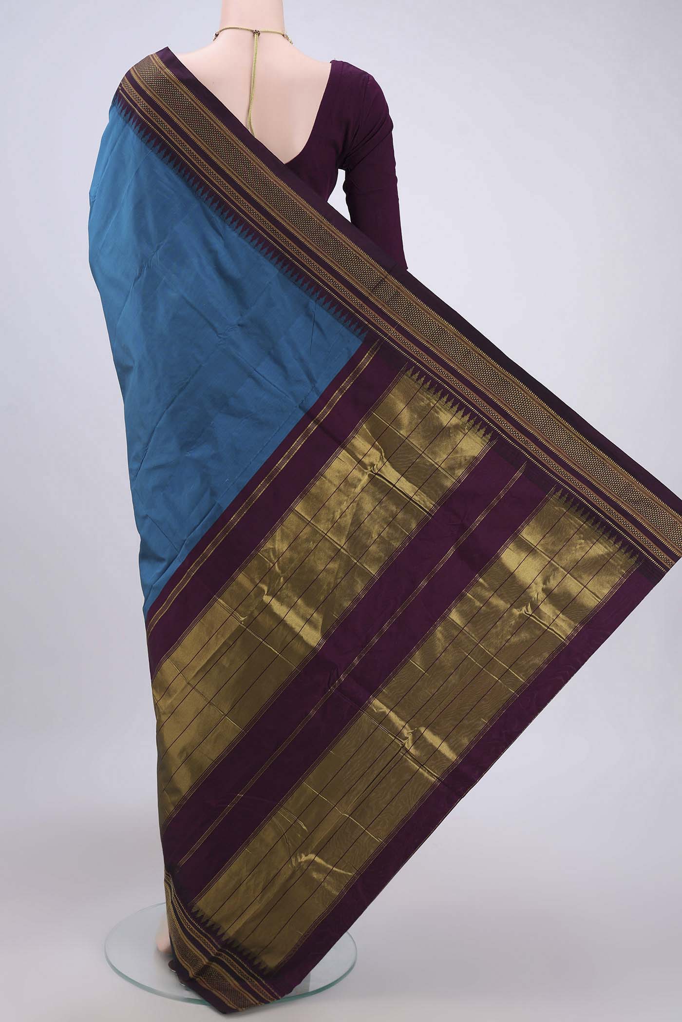 Flat view of Blue Bangalore Silk Saree with Plain Body and Zari Border. 