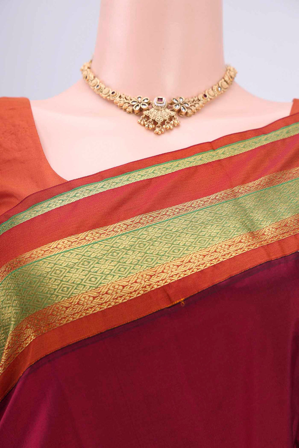 Border image of Maroon Bangalore Silk Saree with Zari Butta on the body and Zari Border. 