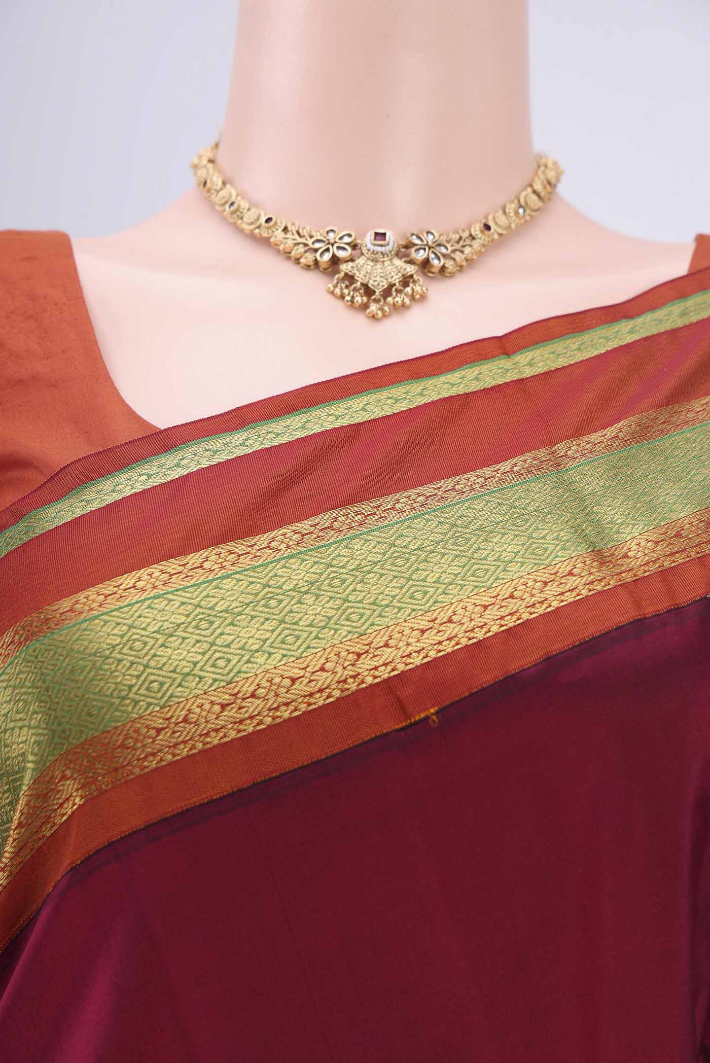 Border image of Maroon Bangalore Silk Saree with Zari Butta on the body and Zari Border. 