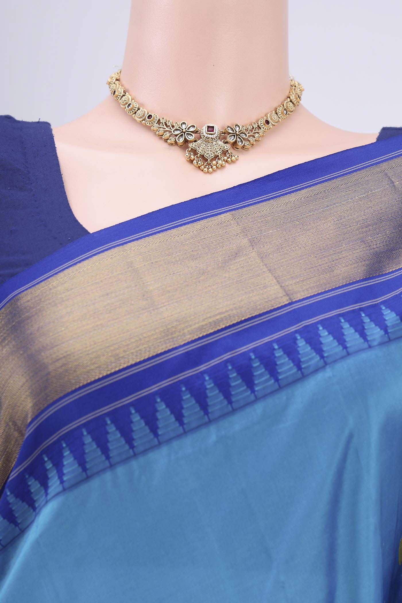 Border image of Blue Bangalore Silk Saree with Zari Butta on the body and Zari Border. 