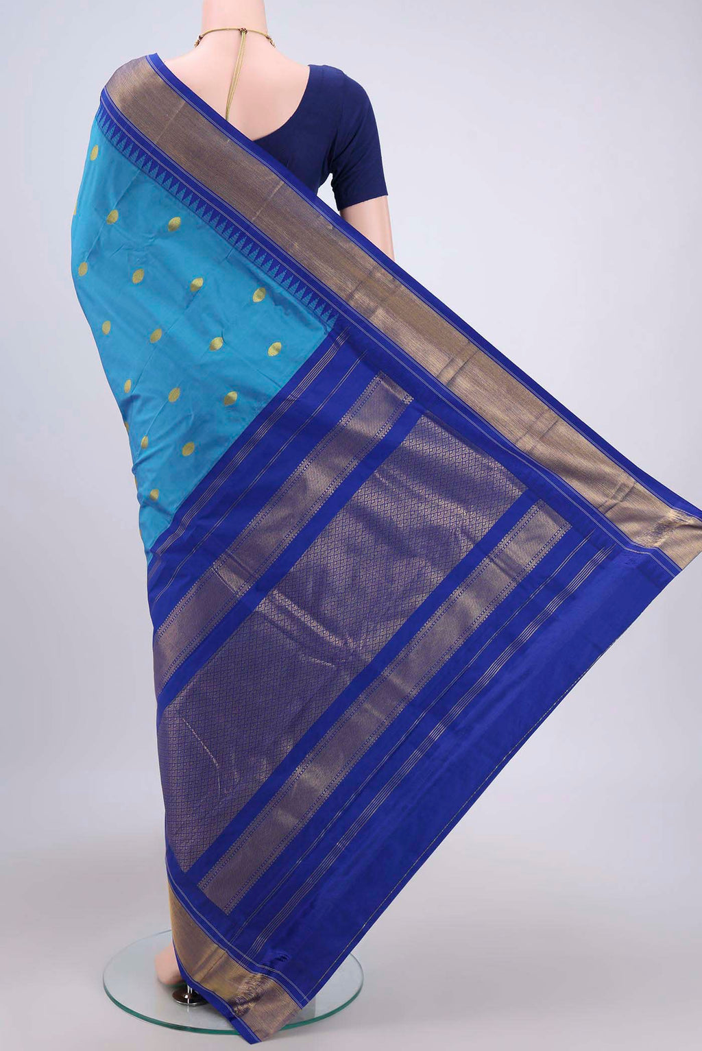 Flat view of Blue Bangalore Silk Saree with Zari Butta on the body and Zari Border. 