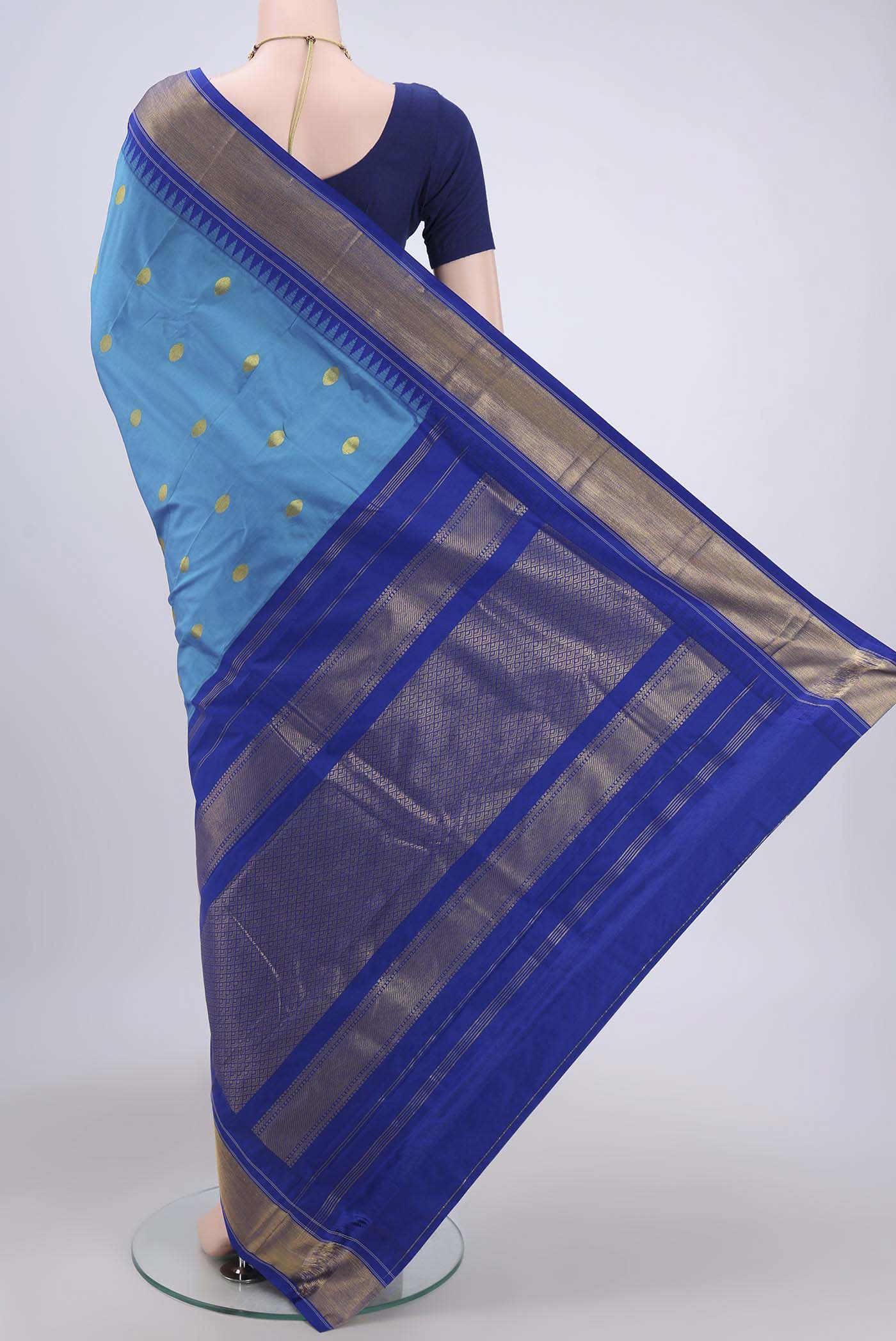Flat view of Blue Bangalore Silk Saree with Zari Butta on the body and Zari Border. 