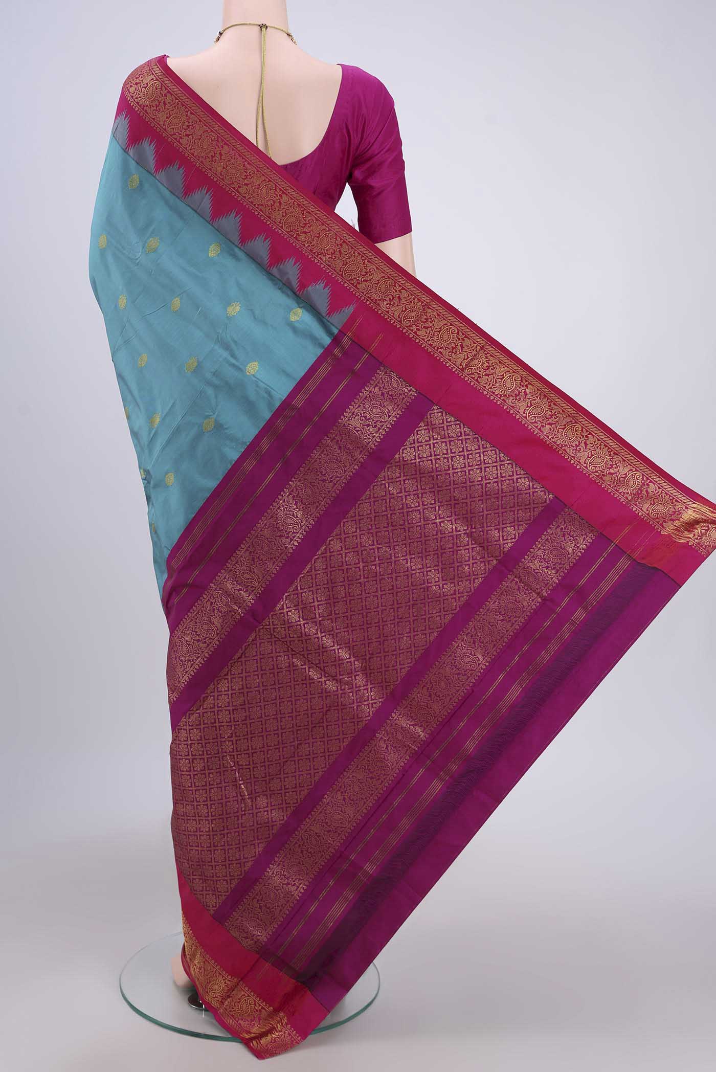 Flat view of Blue Bangalore Silk Saree with Zari Butta on the body and Zari Border. 