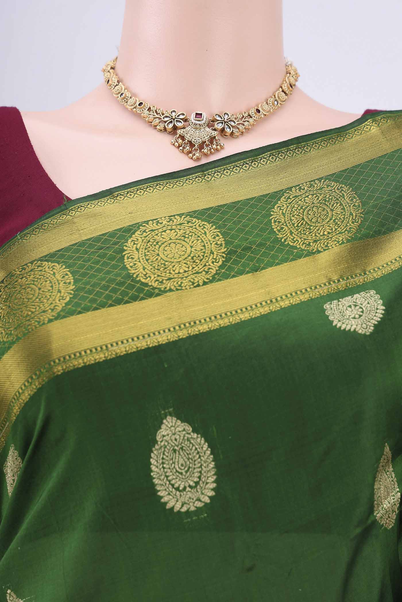 Border image of Bottle Green Bangalore Silk Saree with Zari Butta on the body and Zari Border. 