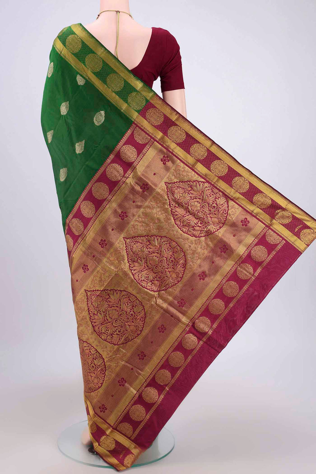 Flat view of Bottle Green Bangalore Silk Saree with Zari Butta on the body and Zari Border. 