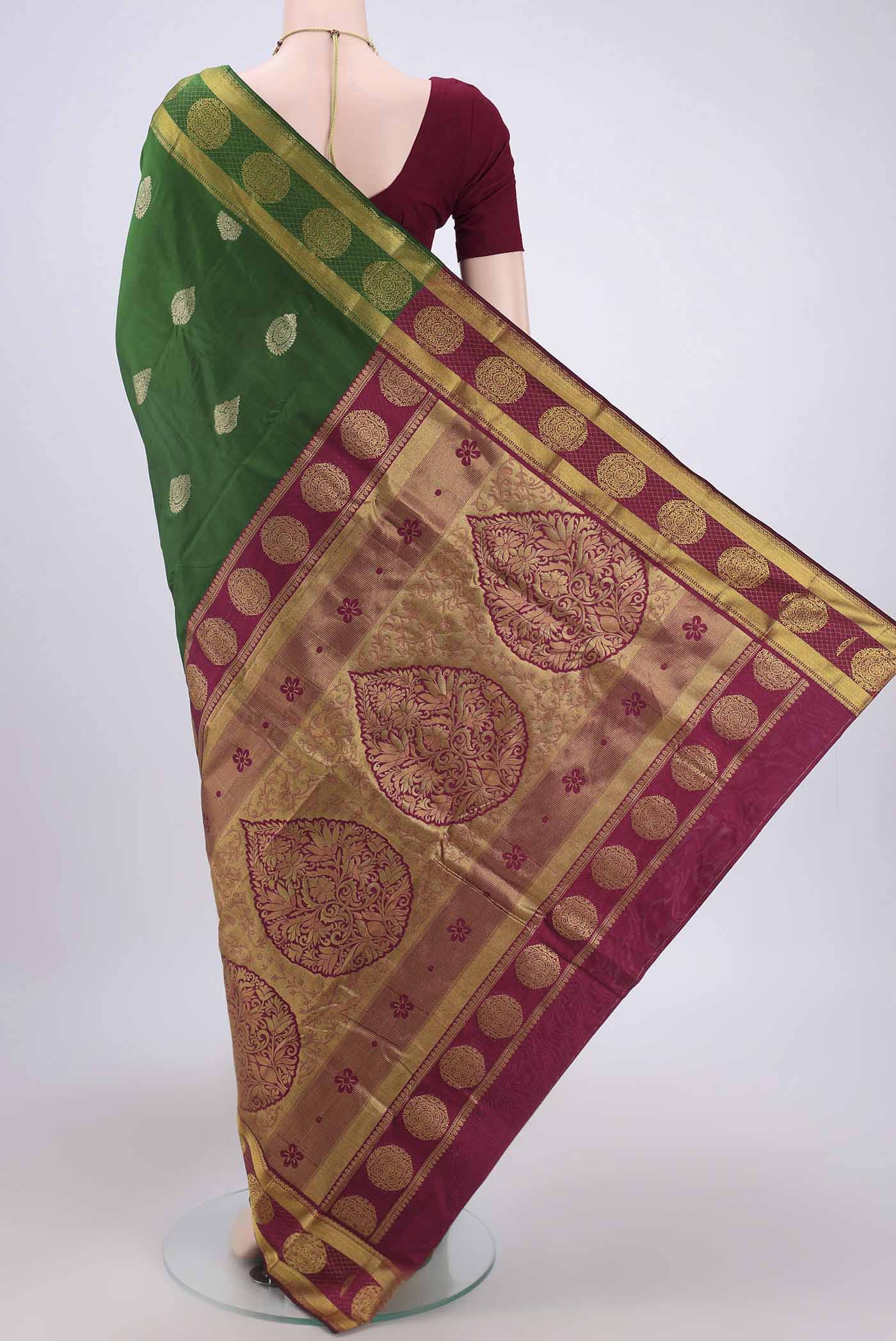 Flat view of Bottle Green Bangalore Silk Saree with Zari Butta on the body and Zari Border. 