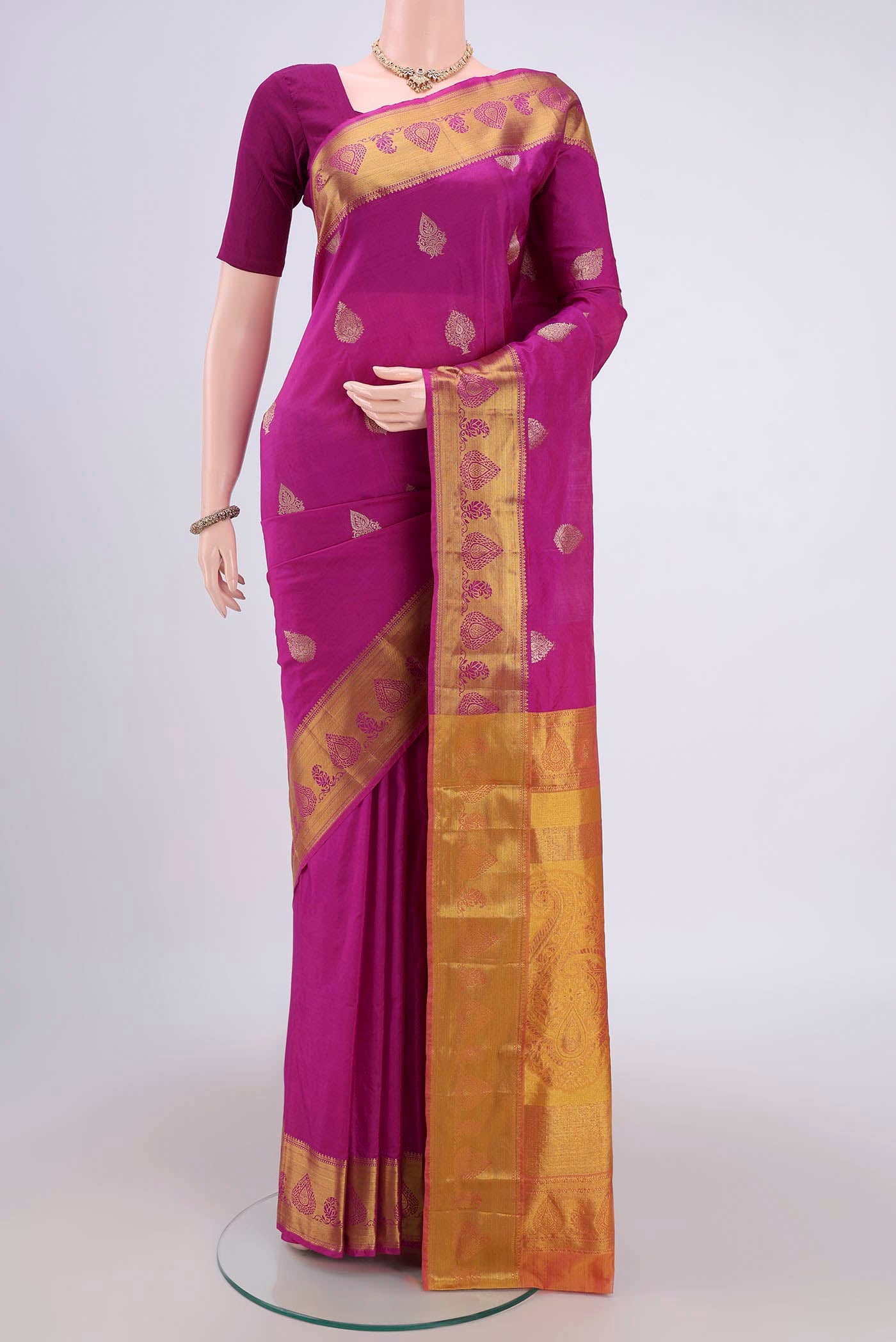 Dark Pink Bangalore Silk Saree with Zari Butta on the body and Zari Border.  displayed on a mannequin