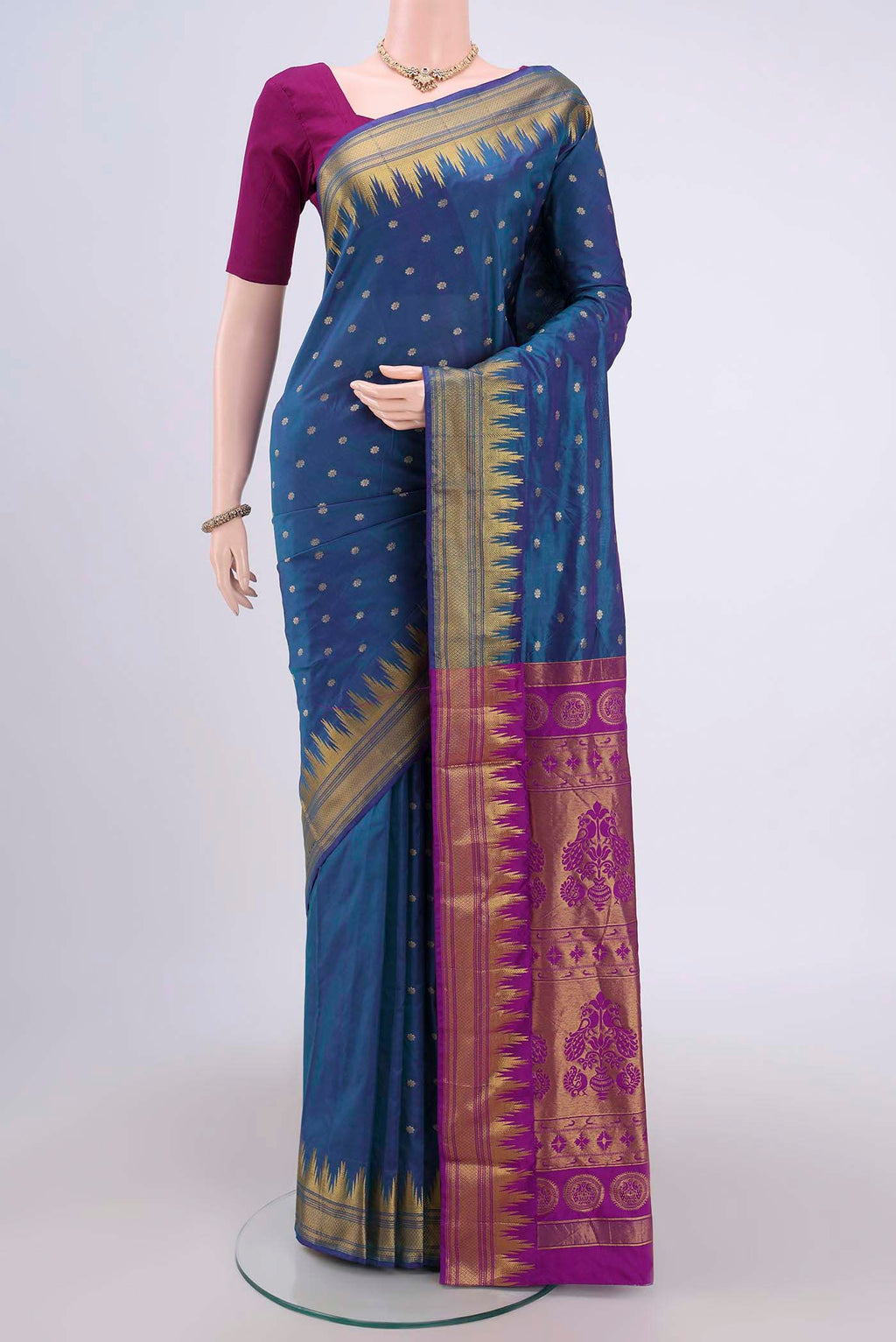 Peacock Blue Bangalore Silk Saree with Zari Butta on the body and Zari Border.  displayed on a mannequin