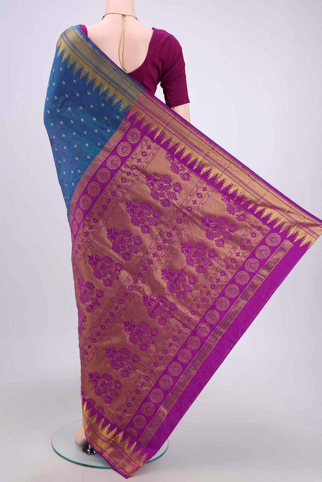 Flat view of Peacock Blue Bangalore Silk Saree with Zari Butta on the body and Zari Border. 