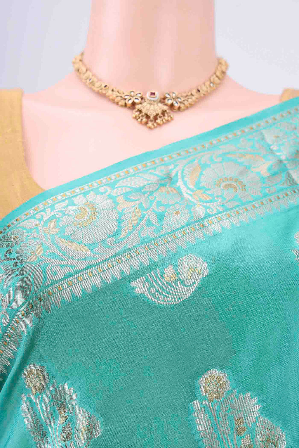 Border image of Turquoise Banarasi Raw Silk Saree with Zari Butta on the body and Zari Border. 