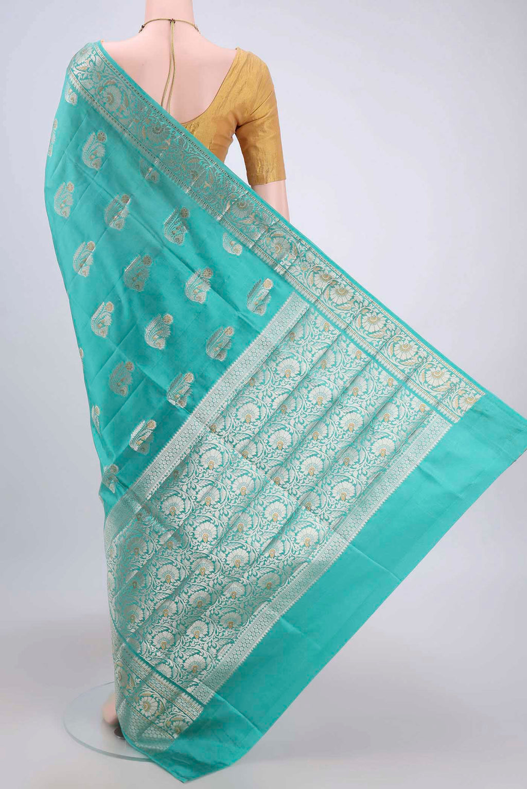 Flat view of Turquoise Banarasi Raw Silk Saree with Zari Butta on the body and Zari Border. 