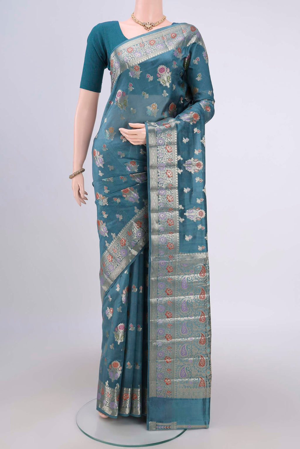 Blue Grey Banarasi Raw Silk Saree with Zari Butta on the body and Zari Border.  displayed on a mannequin