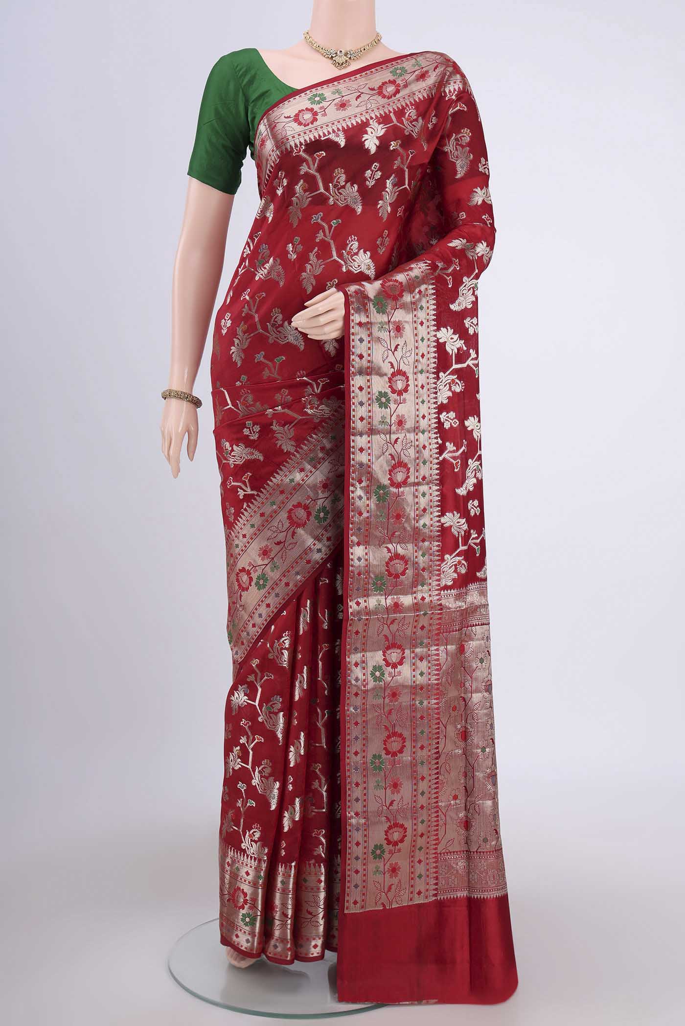 Red Banarasi Raw Silk Saree with Zari Butta on the body and Zari Border.  displayed on a mannequin
