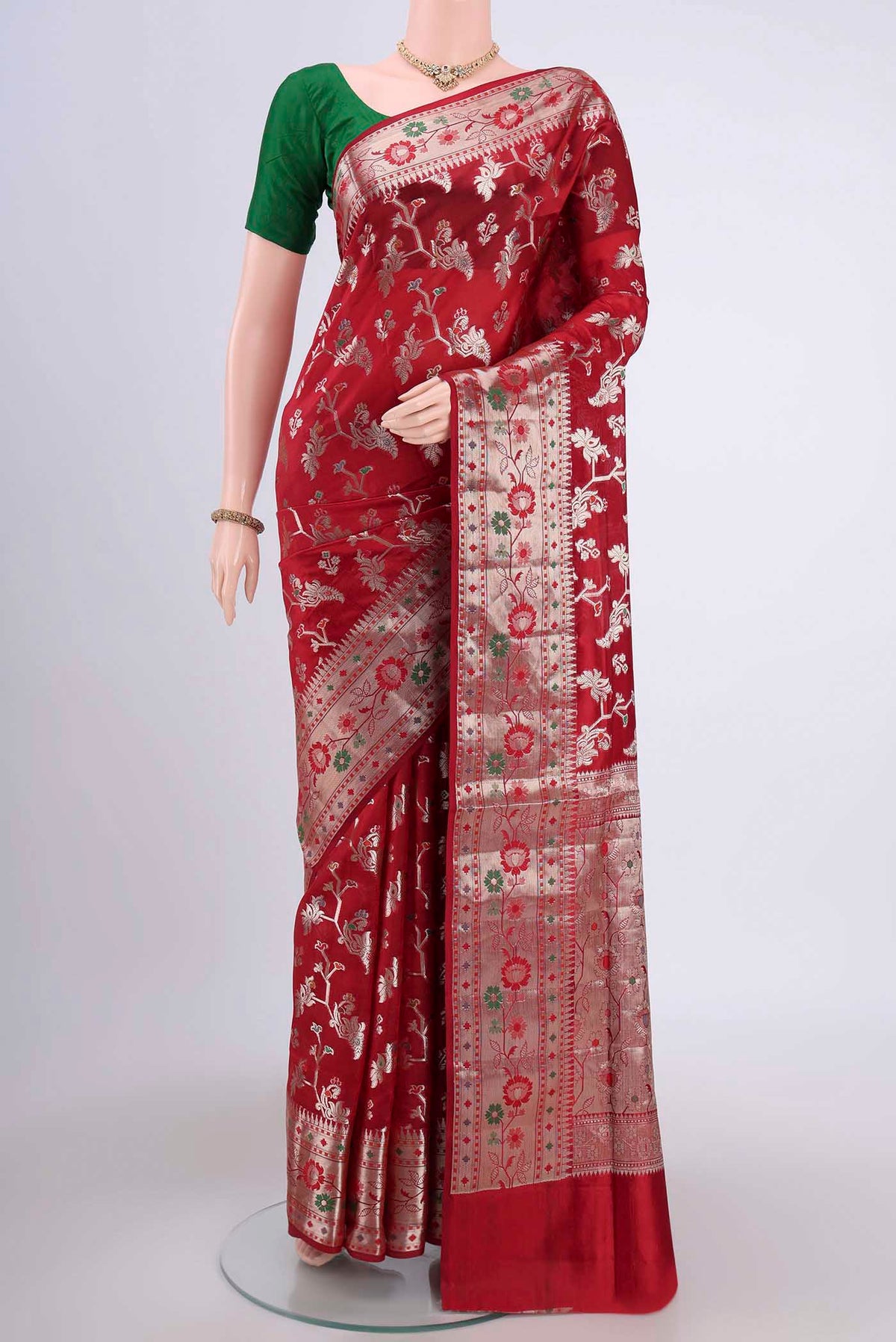 Red Banarasi Raw Silk Saree with Zari Butta on the body and Zari Border.  displayed on a mannequin