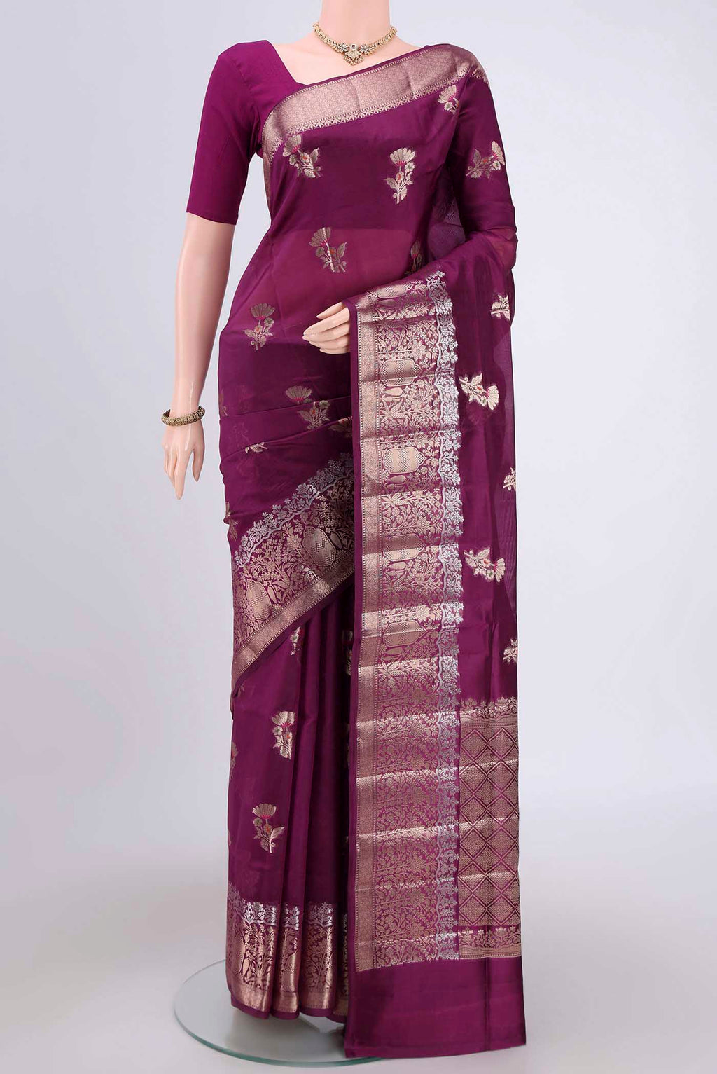 Magenta Banarasi Raw Silk Saree with Zari Butta on the body and Zari Border.  displayed on a mannequin
