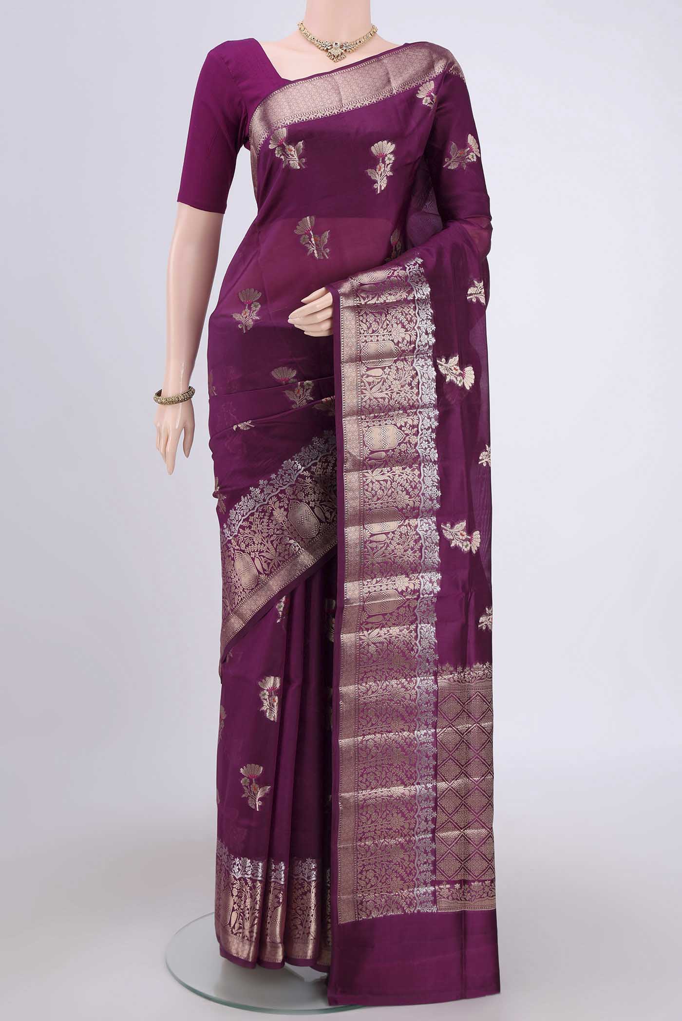Magenta Banarasi Raw Silk Saree with Zari Butta on the body and Zari Border.  displayed on a mannequin