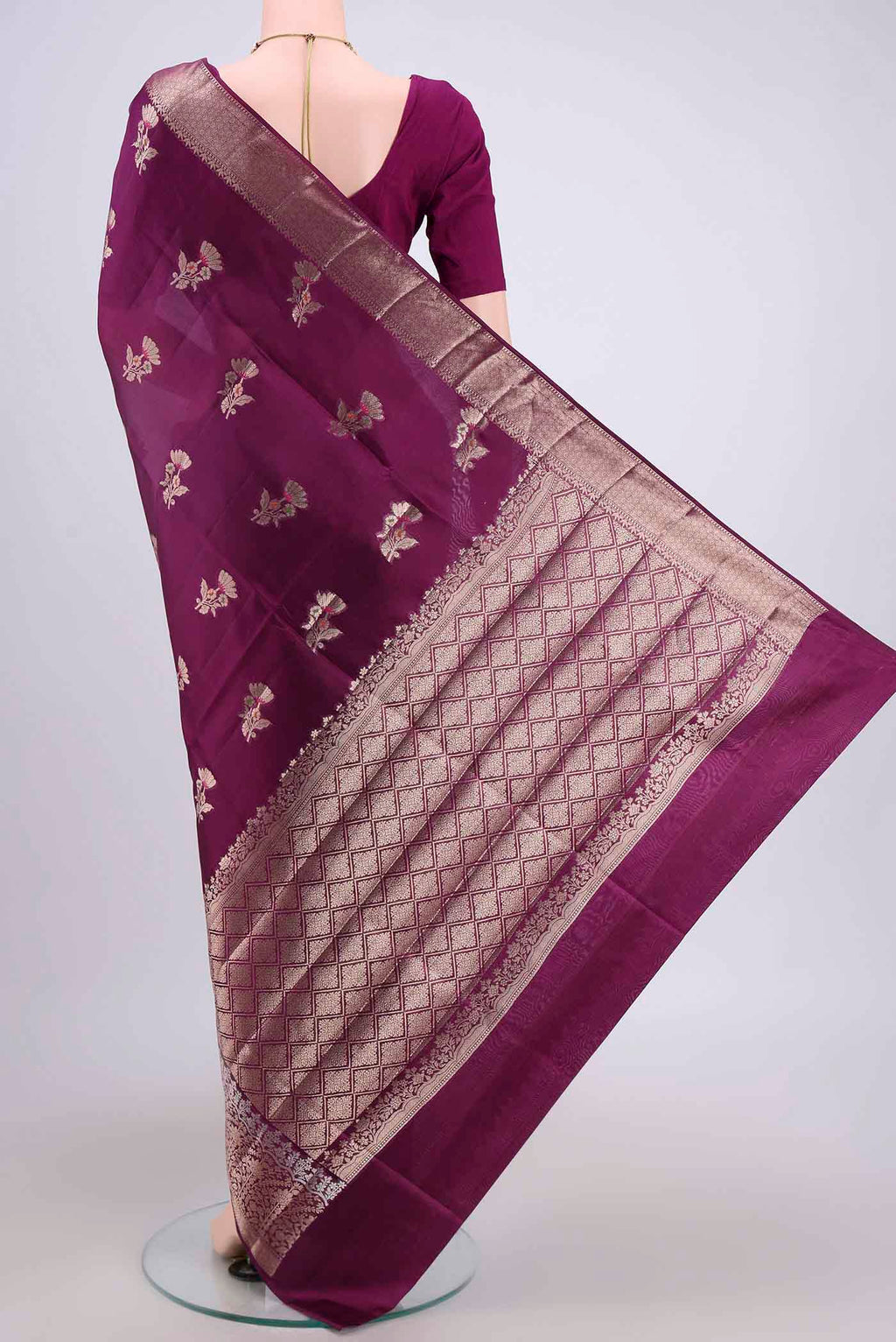 Flat view of Magenta Banarasi Raw Silk Saree with Zari Butta on the body and Zari Border. 