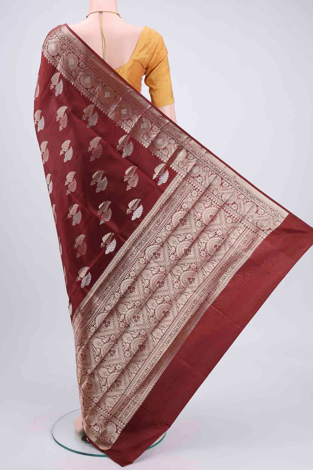 Flat view of Brown Banarasi Raw Silk Saree with Zari Butta on the body and Zari Border. 