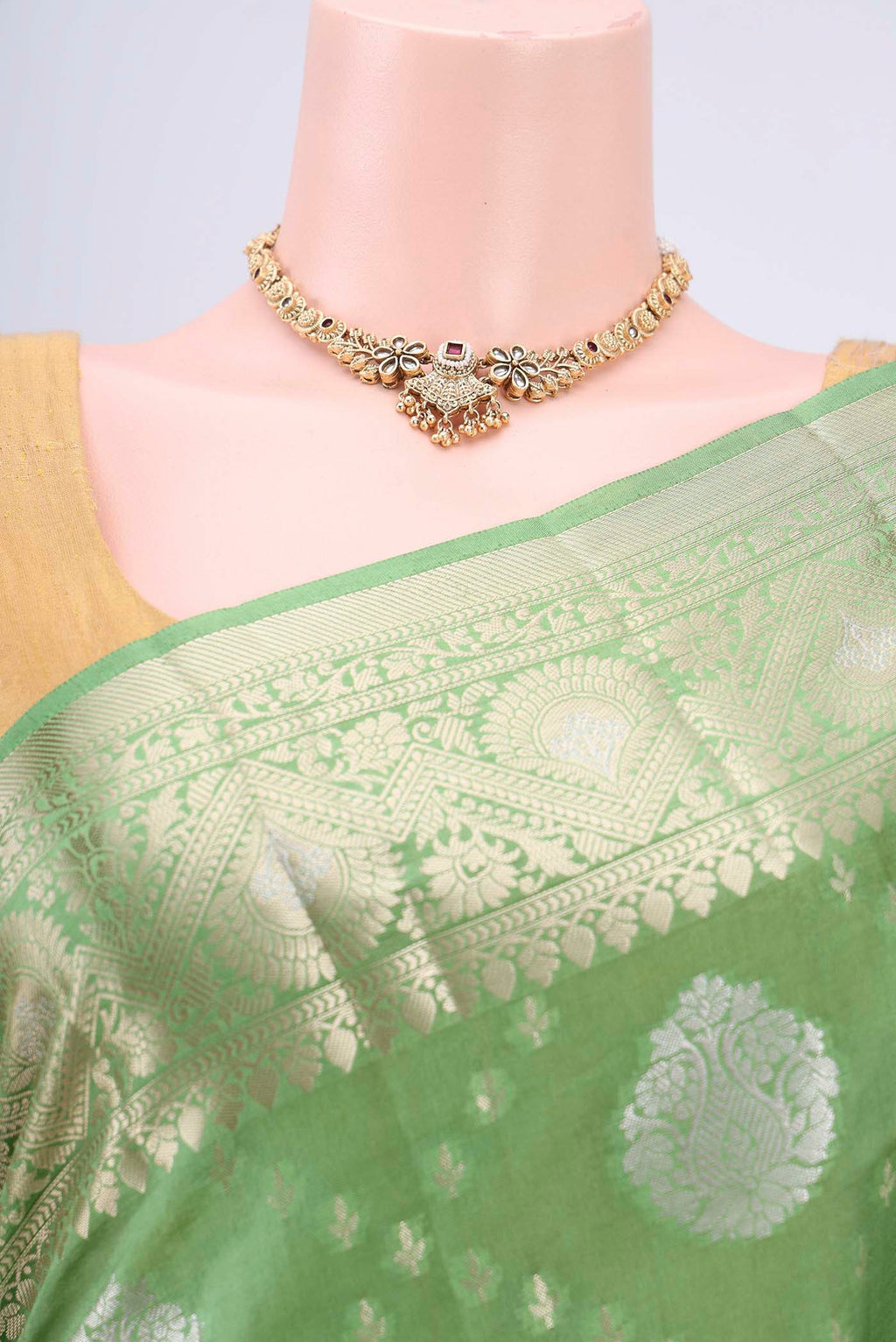 Border image of Light Green Banarasi Raw Silk Saree with Zari Butta on the body and Zari Border. 