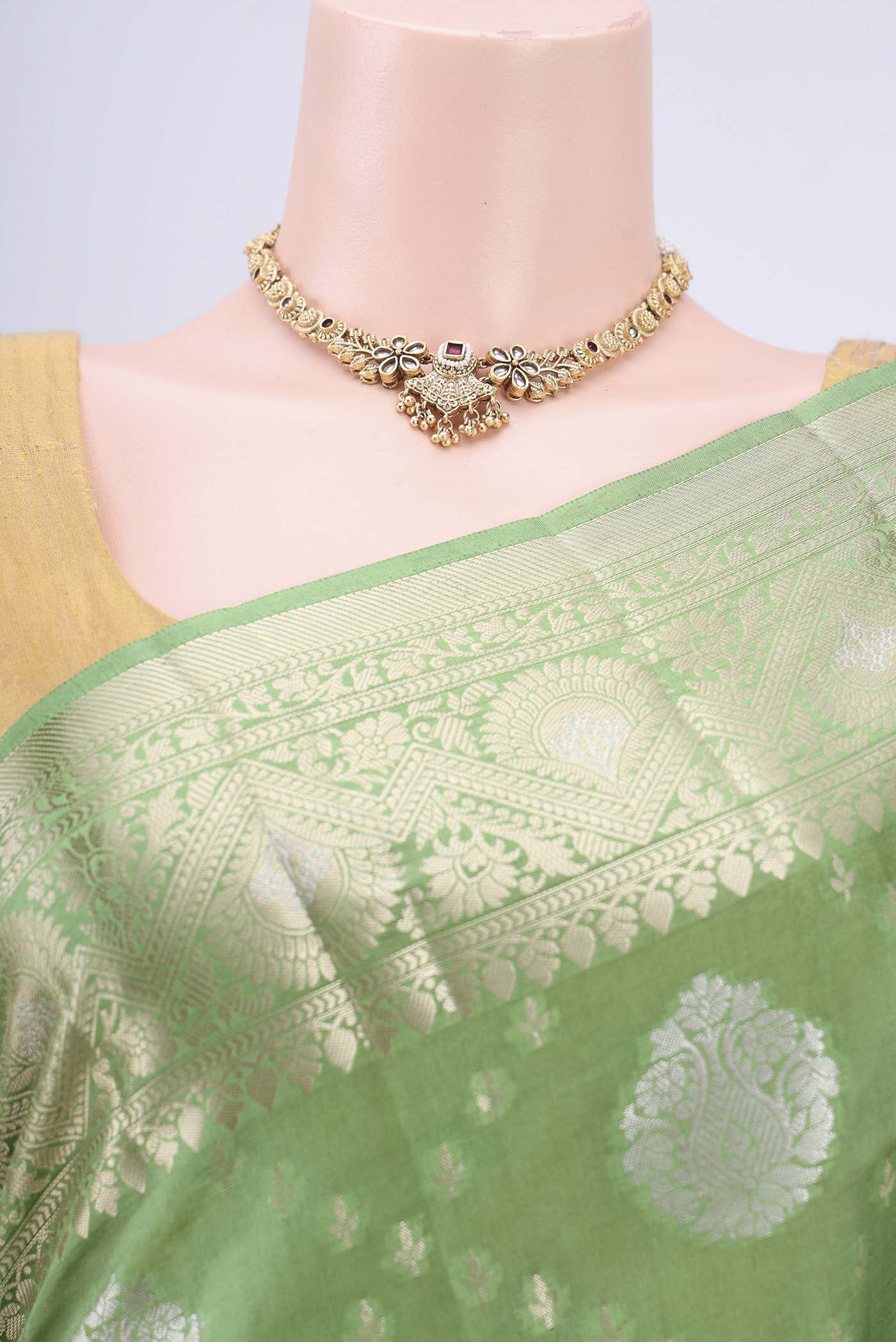 Border image of Light Green Banarasi Raw Silk Saree with Zari Butta on the body and Zari Border. 