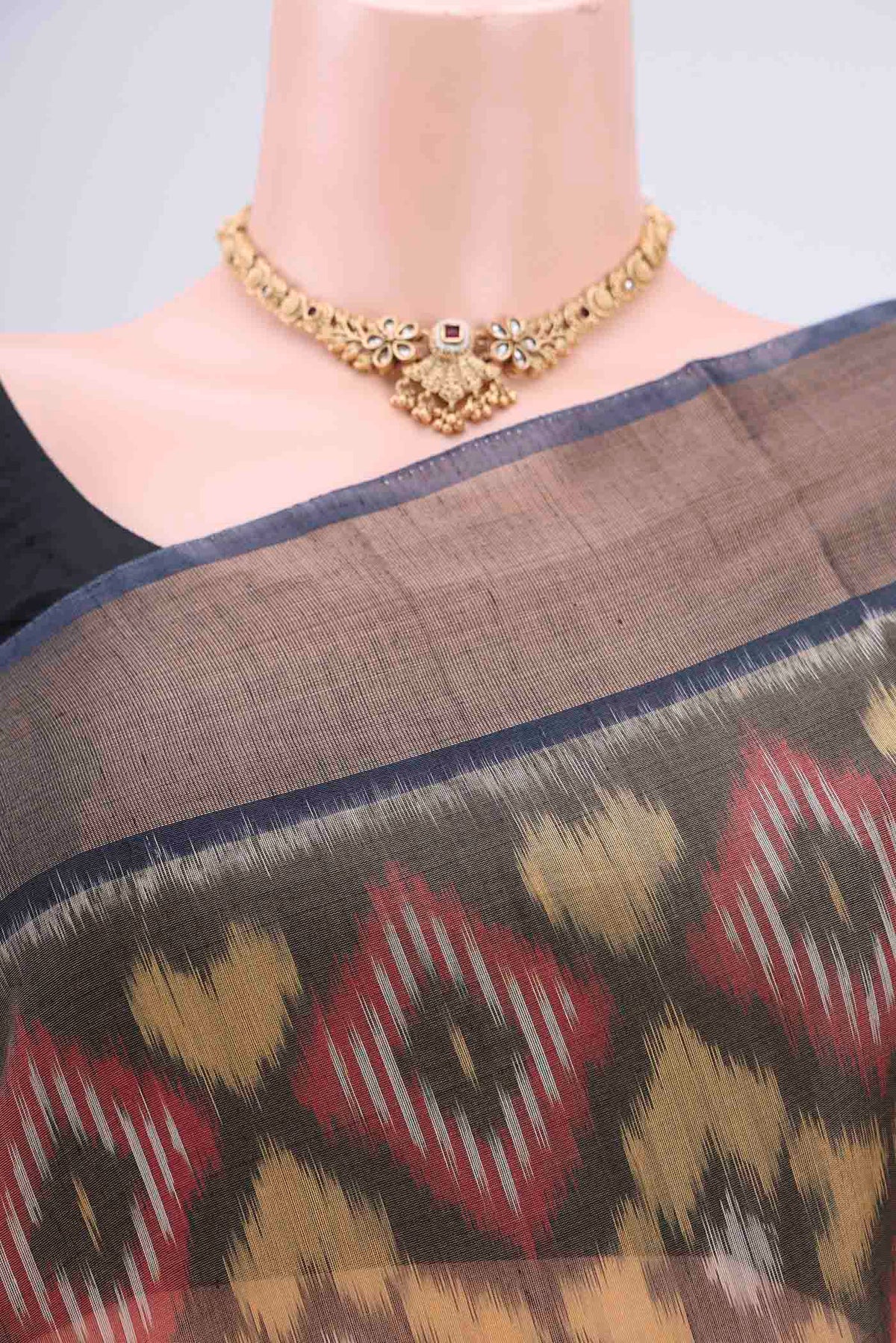 Border image of Yellow Silk Cotton Saree with Ikat design on the body and Zari Border. 