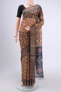Yellow Silk Cotton Saree with Ikat design on the body and Zari Border.  displayed on a mannequin
