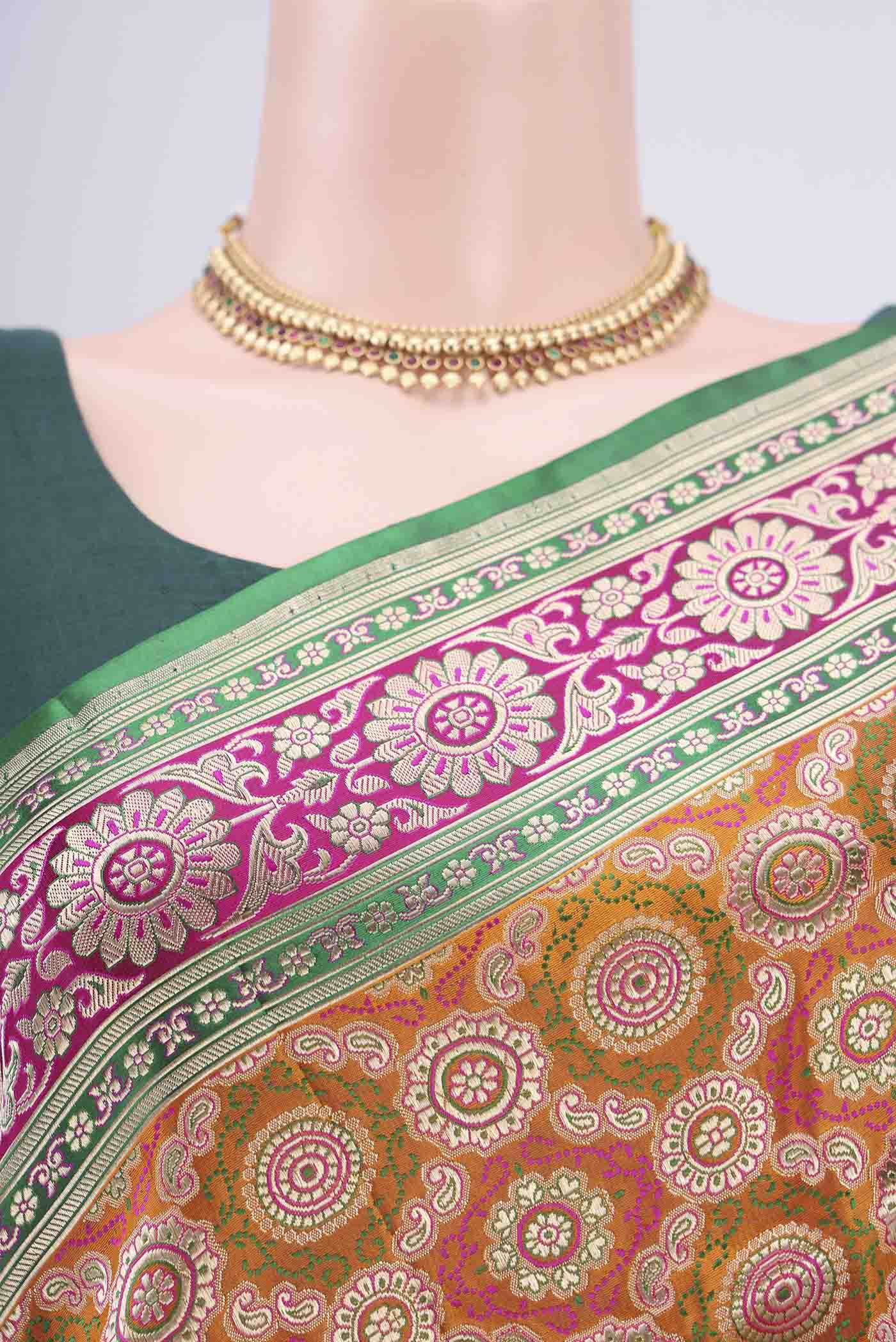 Border image of Orange Banarasi Jamavar Saree with Zari Brocade on the body and Zari Border. 