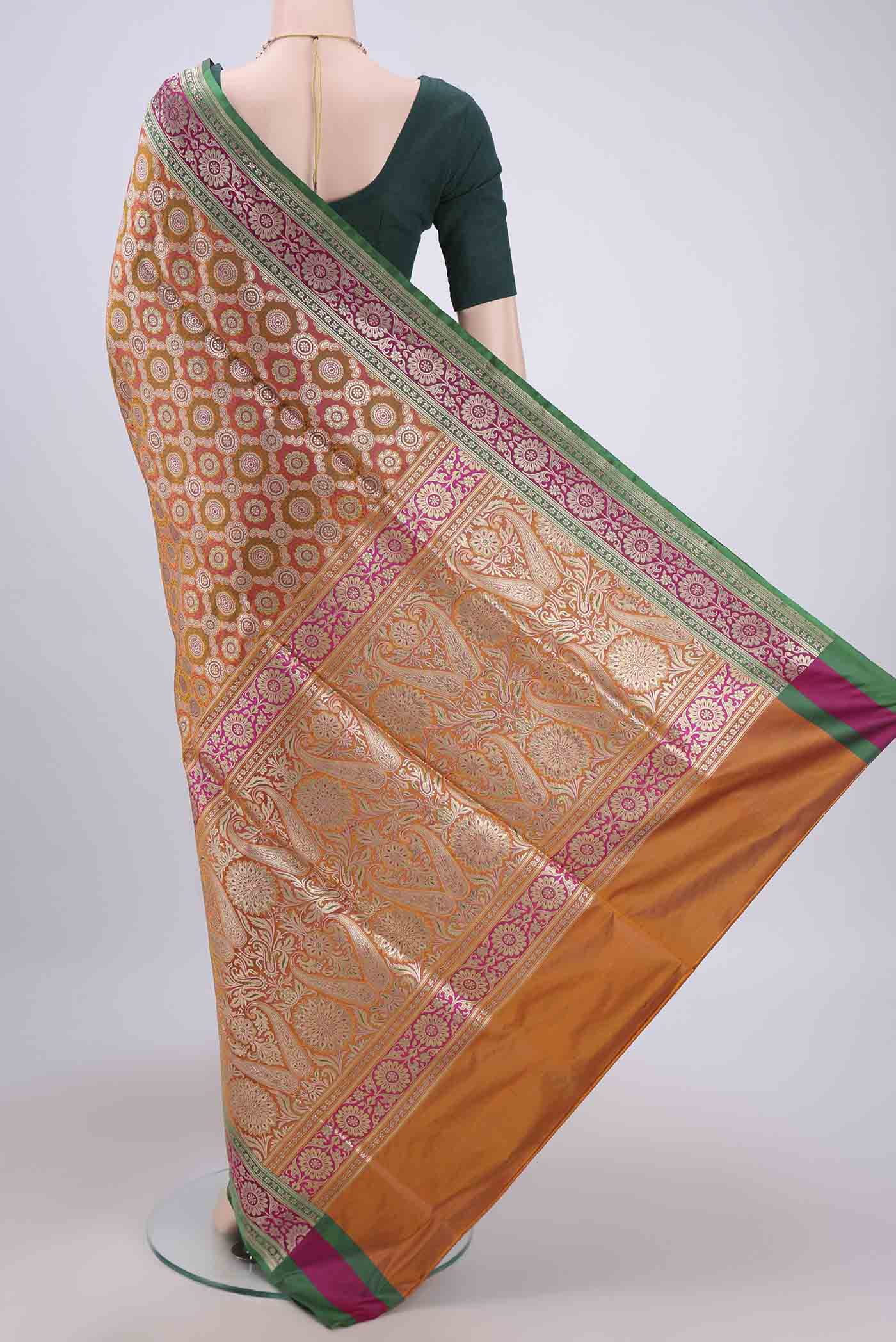 Flat view of Orange Banarasi Jamavar Saree with Zari Brocade on the body and Zari Border. 