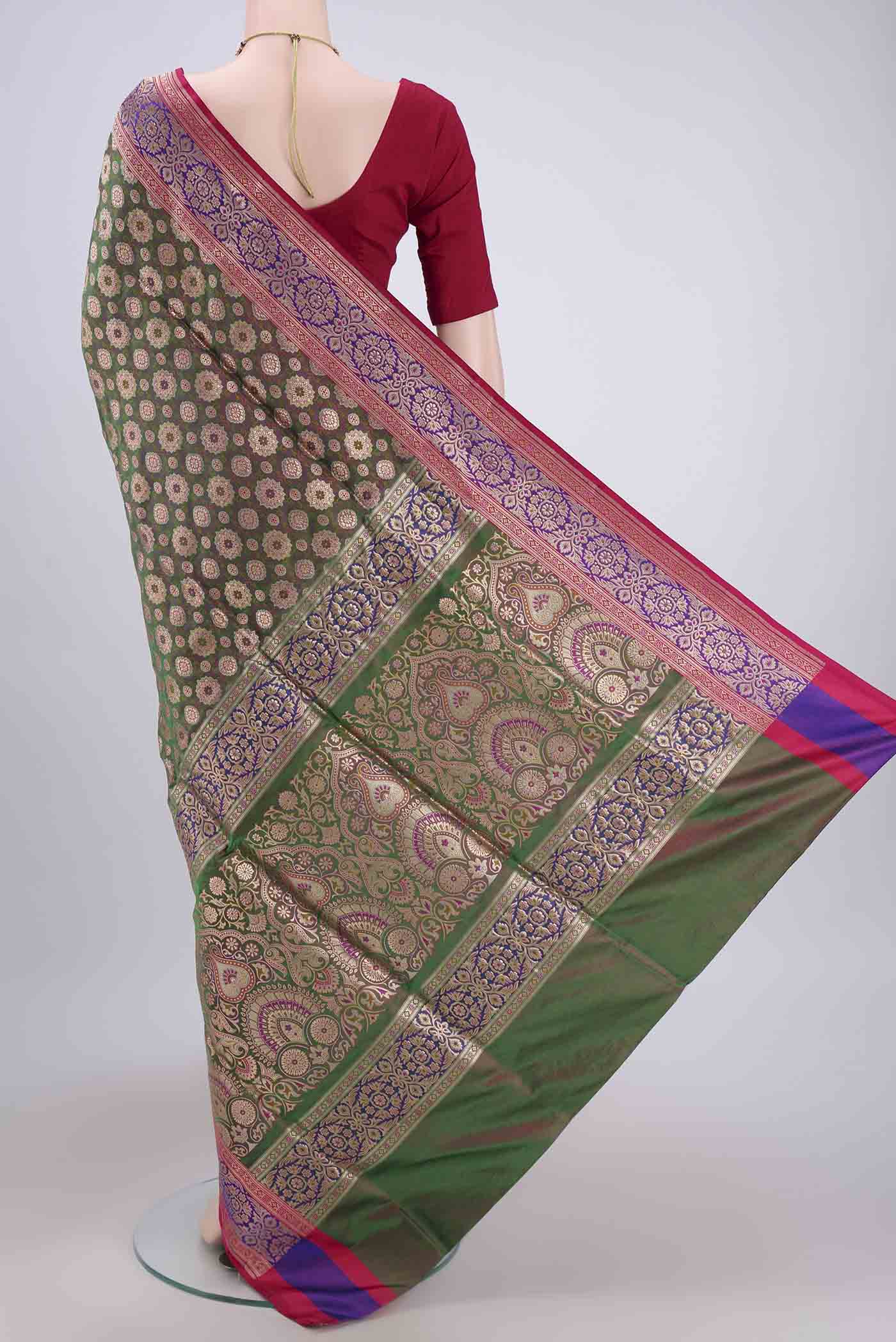 Flat view of Green Banarasi Jamavar Saree with Zari Brocade on the body and Zari Border. 